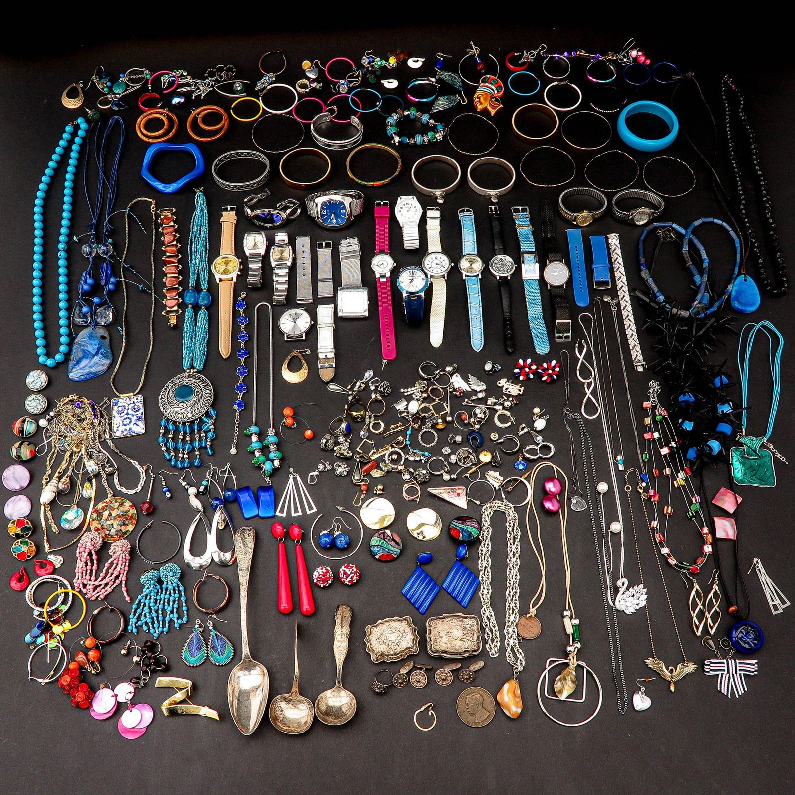 A Diverse Collection of Jewelry: From various jewelry and watches, including silver.