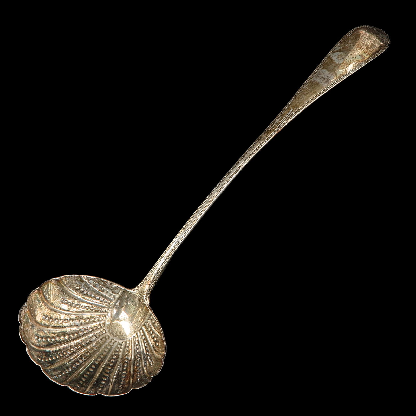 A Soup Spoon: With embossed bowl, 18th century, length 34 cm.