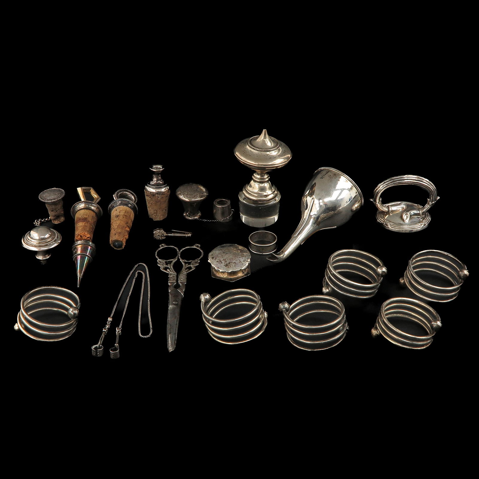 A Diverse Group of Items: including silver napkin holders, master's mark DCW, length 49 cm.