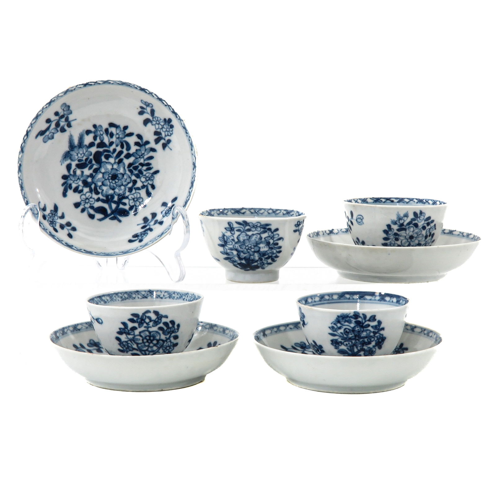 A Group of 4 Cups and Saucers: Decorated with floral sprays, 18th Century, saucers are 11 cm. in diameter, chip.