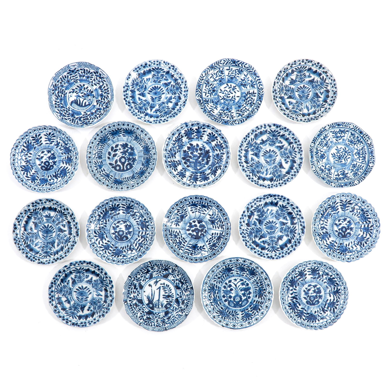 A Collection of Saucers: In a variety of blue and white decors, including 18th Century, largest saucer is 10 cm. in diameter, chip and hairline.