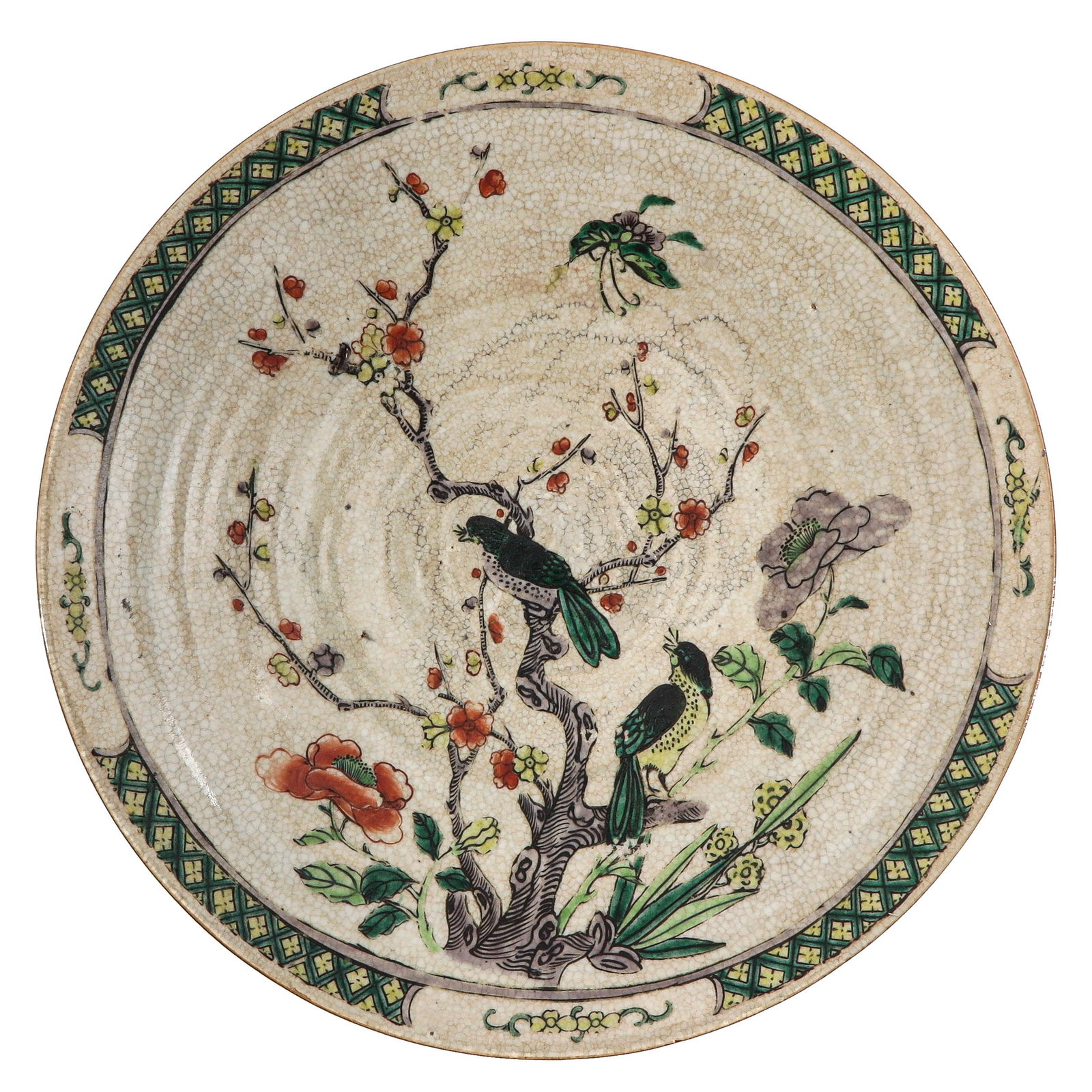 A Nanking Charger: Decorated with Famille Verte enamels with birds perched on flowering branches, 38 cm. in diameter, chip.
