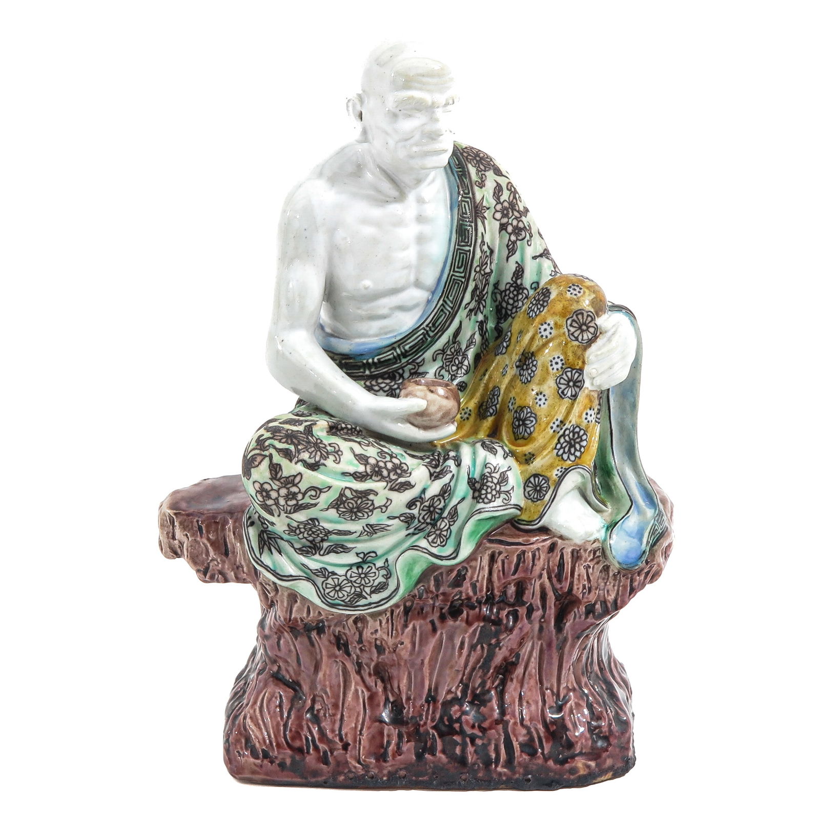 A Famille Verte Sculpture: Depicting a figure sitting on a rock, Republic Period, 26 cm. tall.