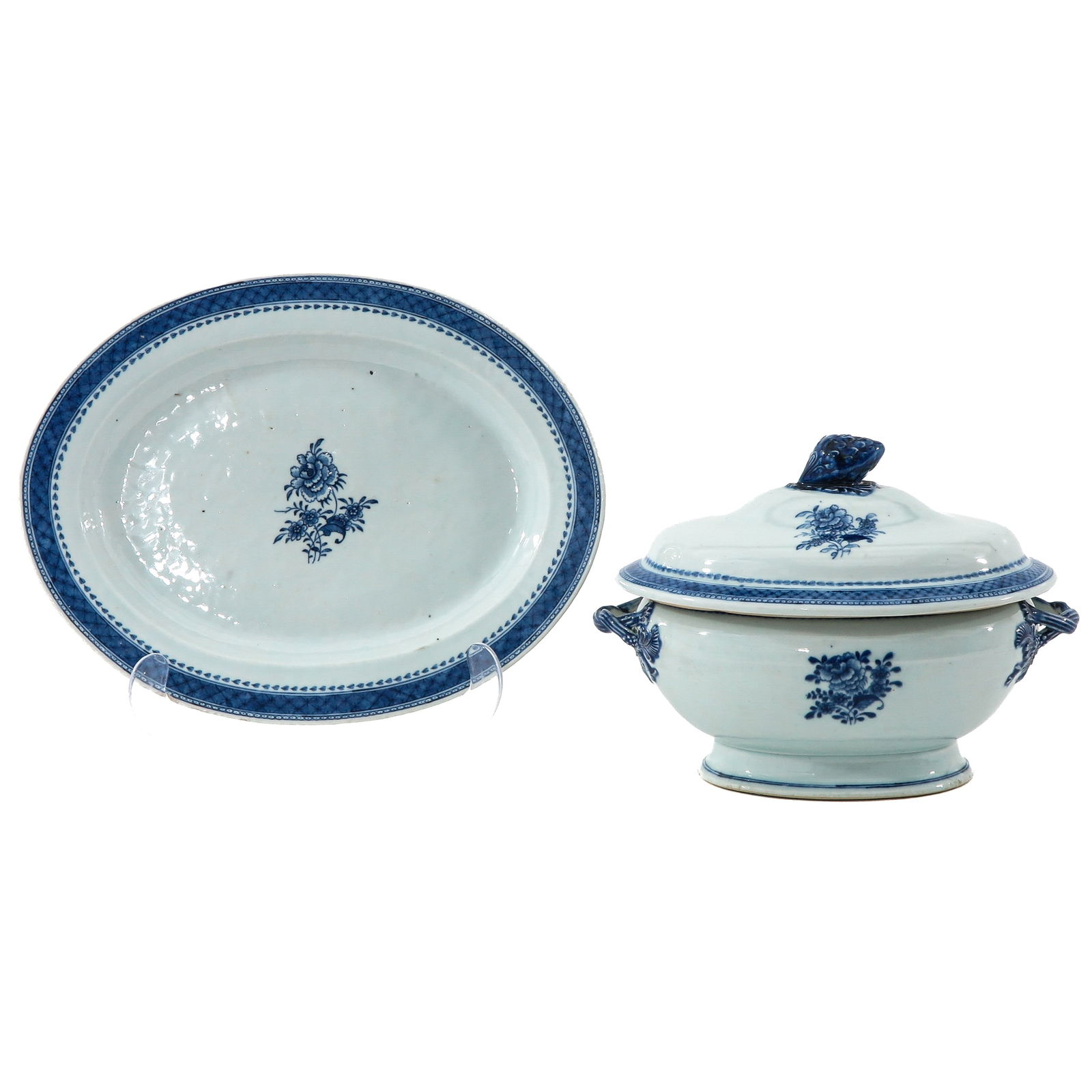 A Soup Tureen with Cover and Platter: Decorated with a central floral motif, circa 1800, platter is 40 cm. long, chip and hairline.