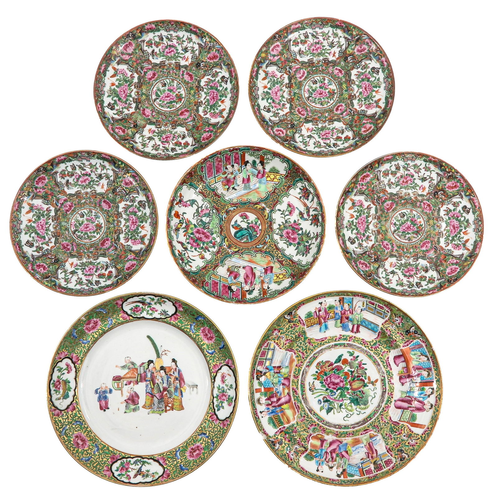 A Group of 7 Cantonese Plates: Decorated with peonies, birds, and figural scenes in Famille Rose enamels, largest plate is 25 cm. in diameter, chip and hairline.