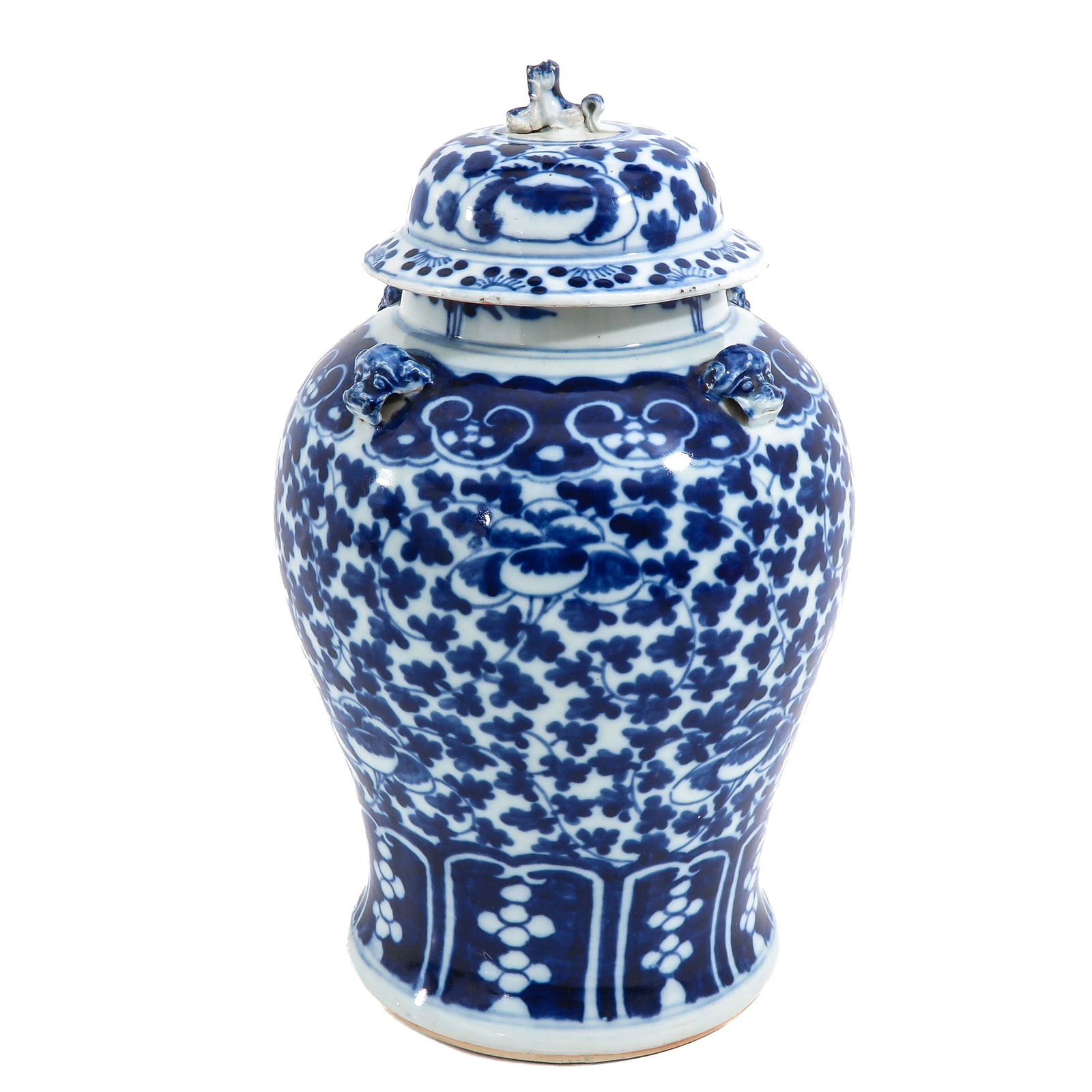 A Blue and White Jar with Cover: Scrolling floral decor, 19th Century, 43 cm. tall, chip on cover.