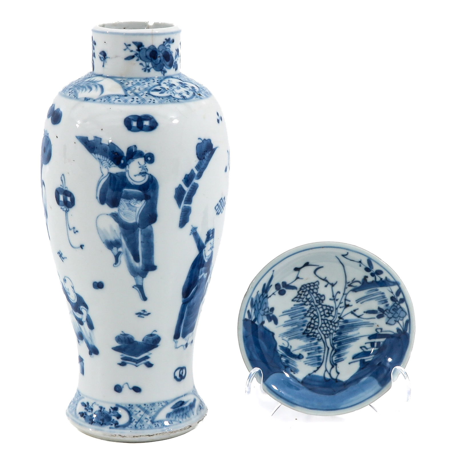 A Blue and White Vase and Saucer: Vase decorated with various figures together with a small blue and white saucer with flowers and rockwork, vase is 26 cm. tall, chip and hairline.