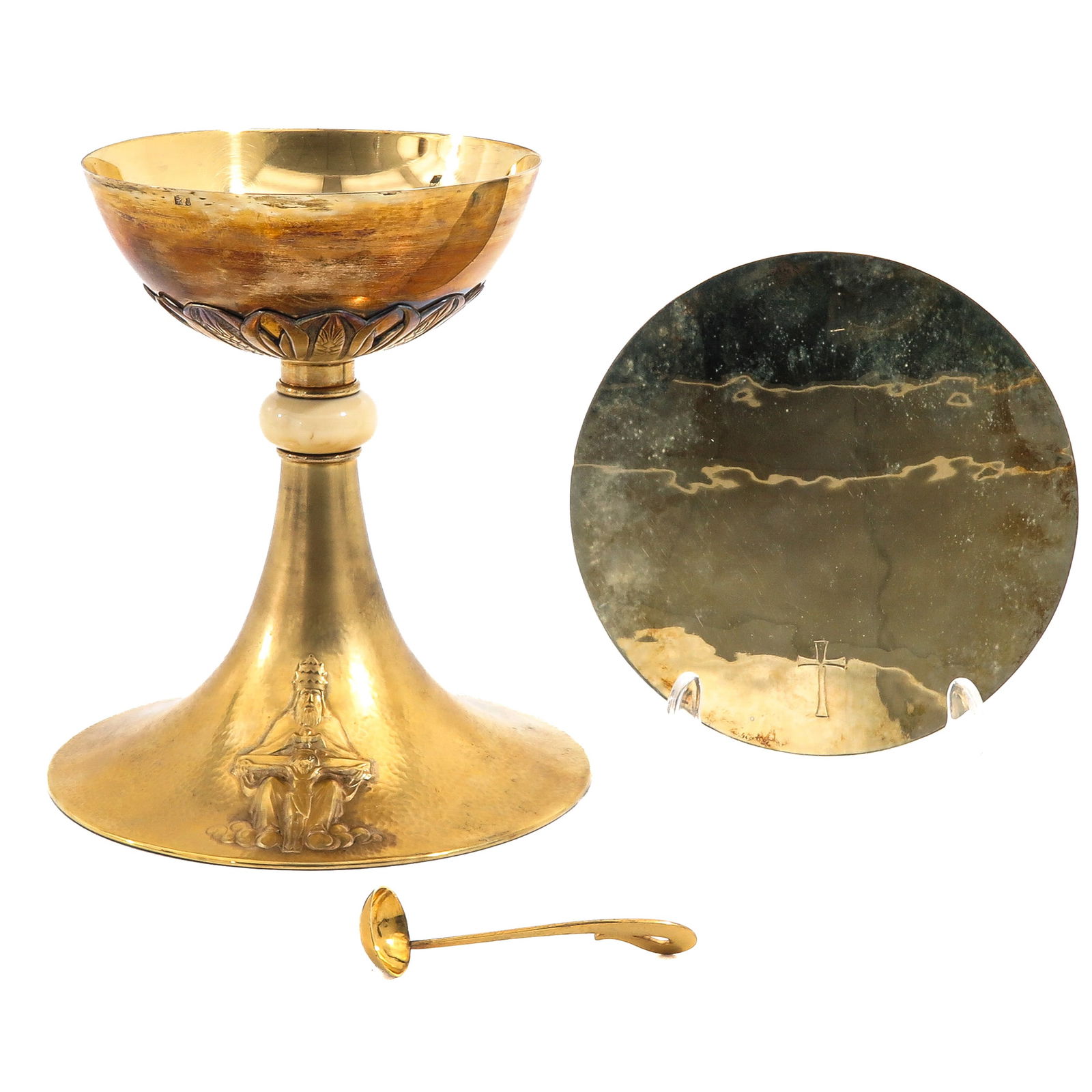 A Chalice: With paten and spoon. Cuppa and pate are gilded silver, with case, height 19 cm.