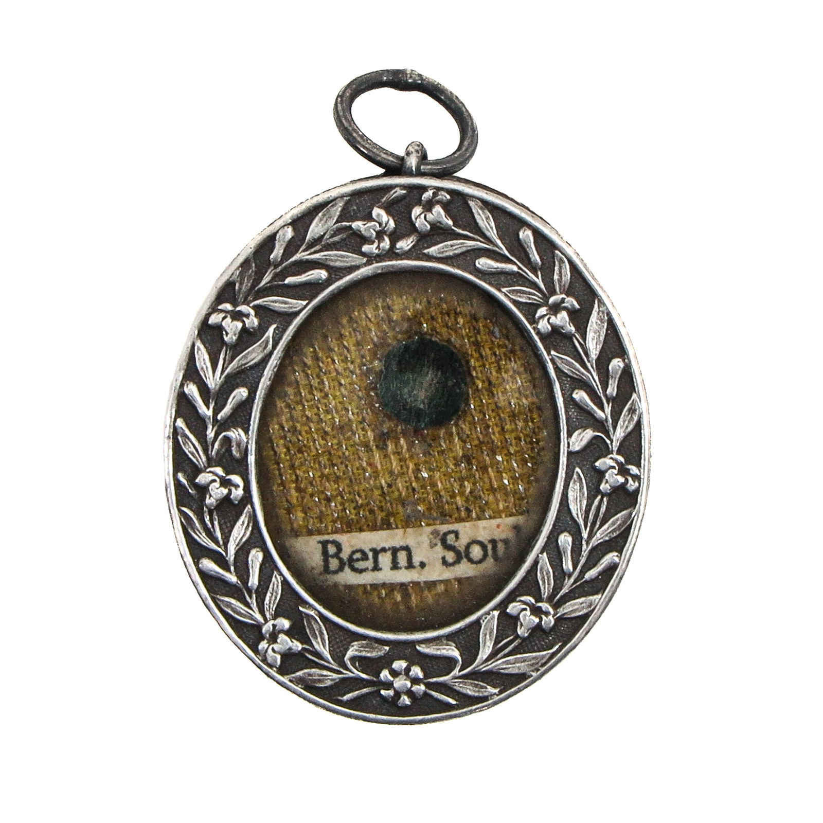A Sealed Reliquary Pendant: Silver, containing a relic of Saint Bernadette Soubirous, visionary of Lourdes (patroness of the sick and Lourdes pilgrims), length 3.5 cm. You are purchasing the theca; the relics are a gift.