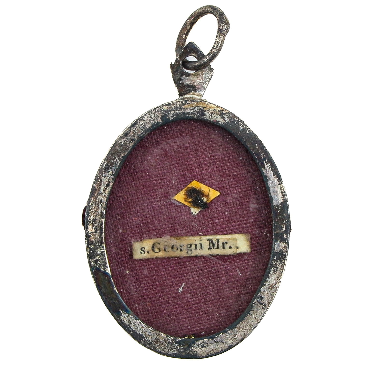 A Sealed Reliquary: Including a relic of Saint George, martyr (patron of knights, soldiers, and patron saint against evil), length 4 cm. You are purchasing the theca; the relics are a gift.