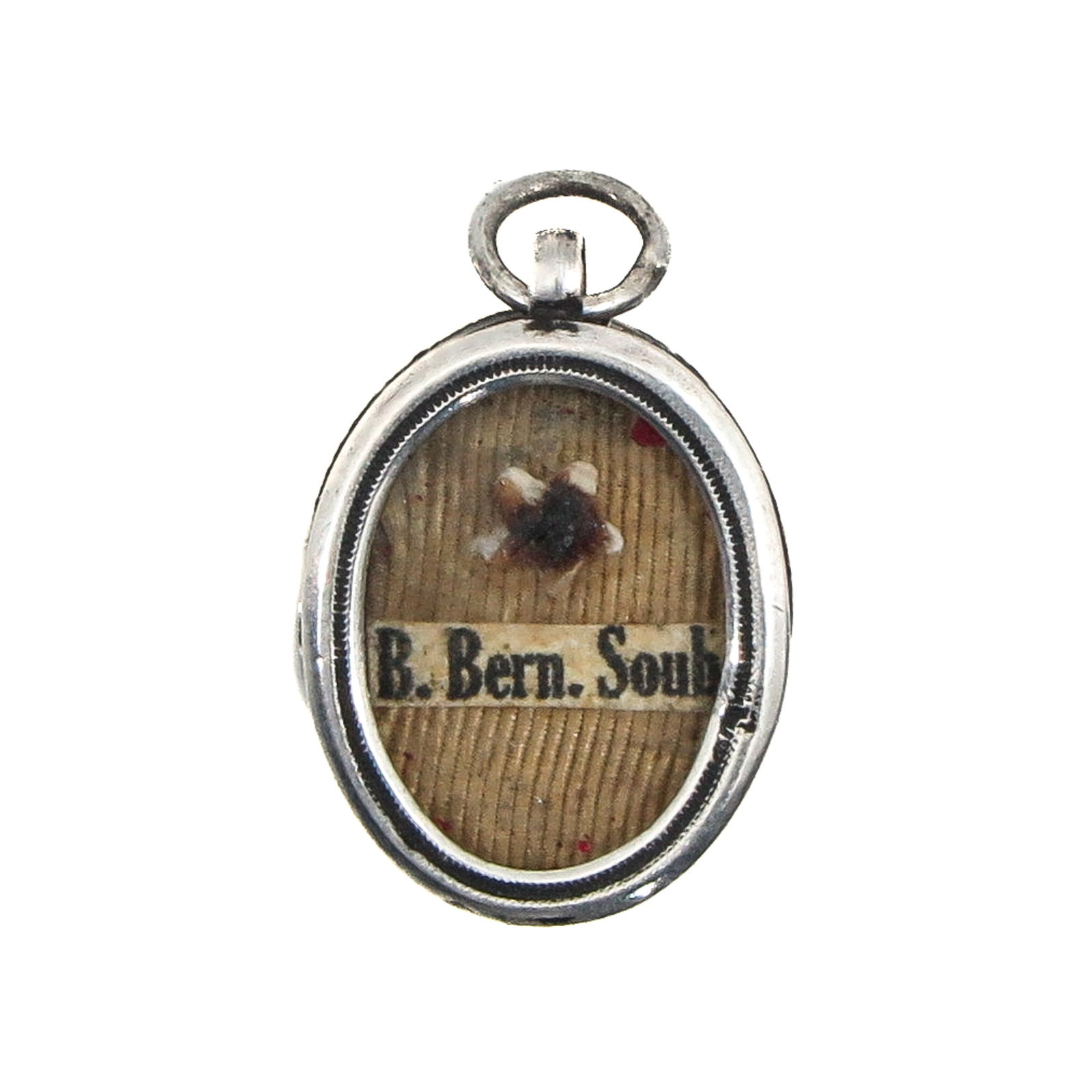 A Sealed Reliquary: Silver, containing a relic of Saint Bernadette Soubirous, visionary of Lourdes (patroness of the sick and Lourdes pilgrims), length 2 cm. You are purchasing the theca; the relics are a gift