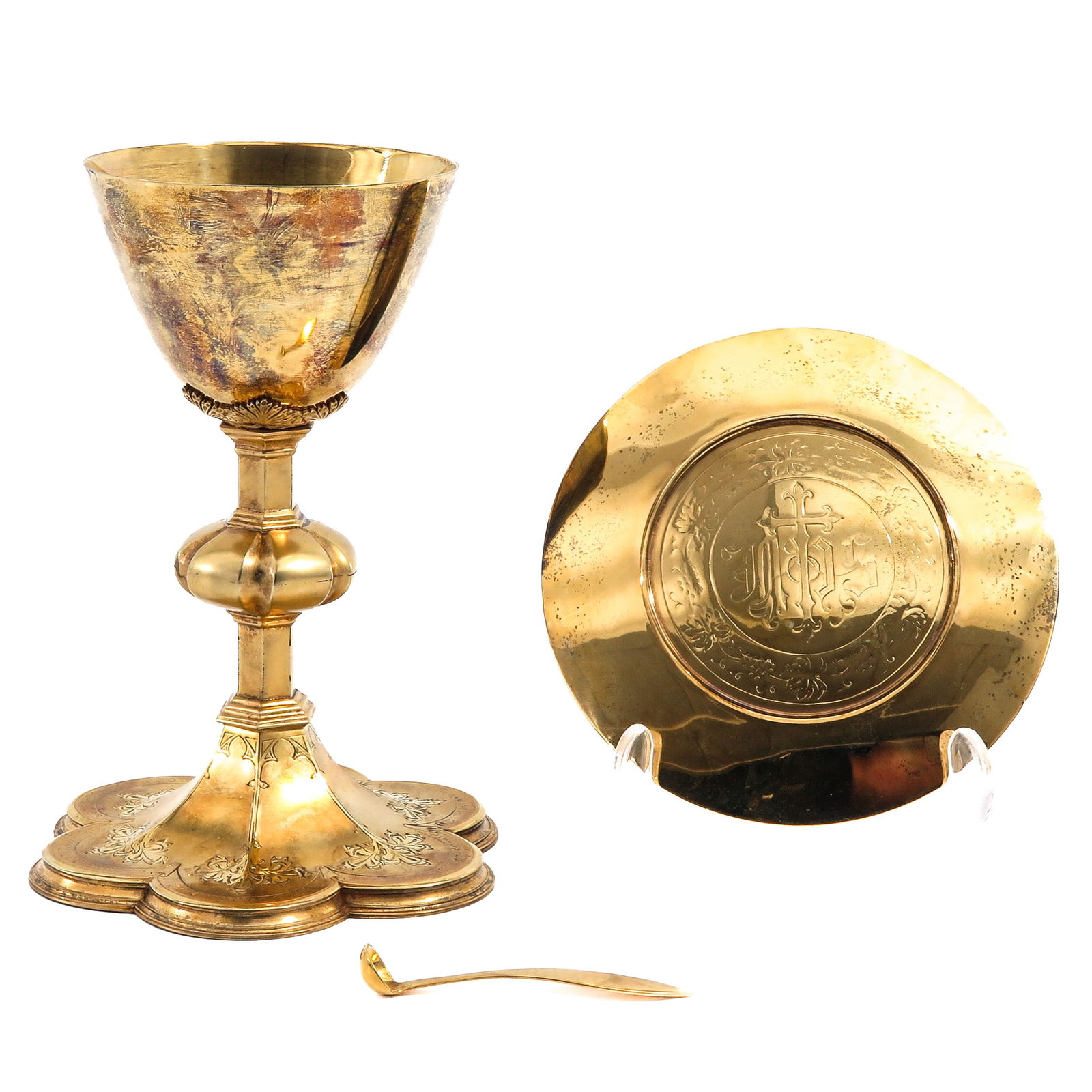 A Chalice: With paten and spoon, Neo-Gothic, silver-gilt cuppa with case, height 19 cm.