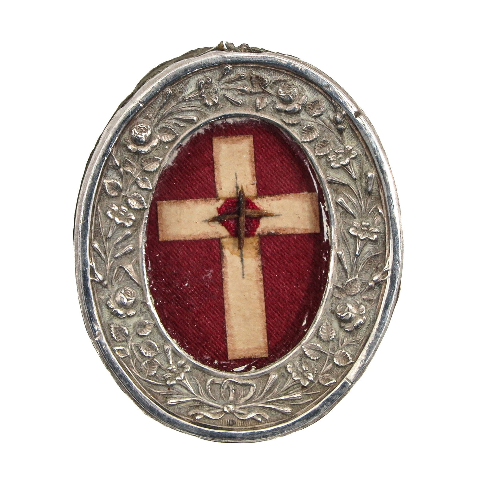 A Sealed Theca: Silver, containing a relic of the Holy Cross, length 5 cm. You are purchasing the theca; the relics are a gift.