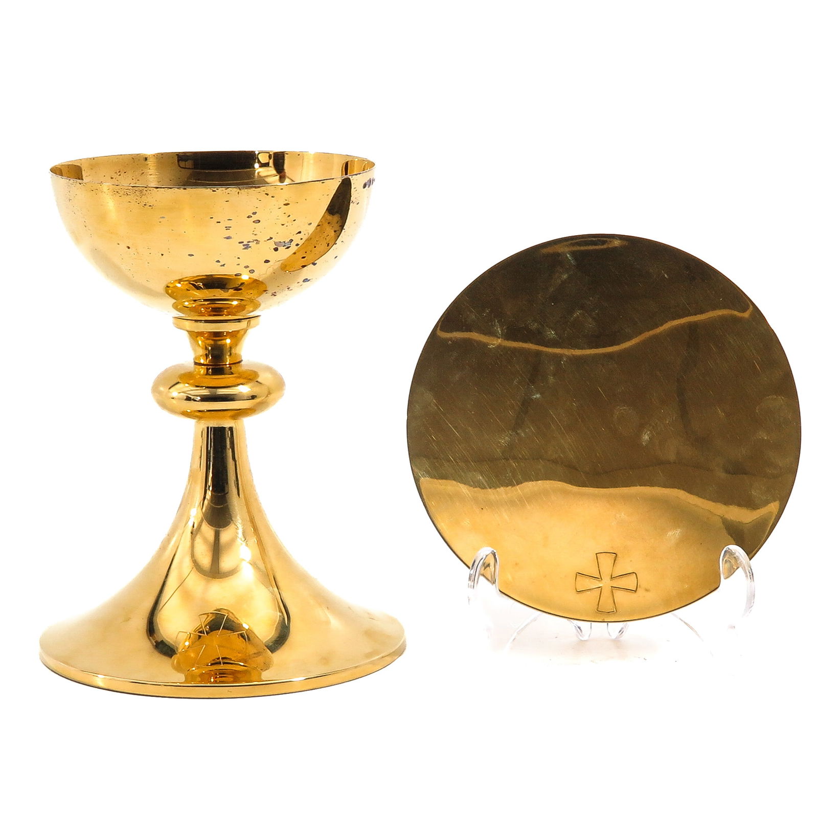 A Chalice: With paten, silver-gilt cuppa, with case, height 18 cm.