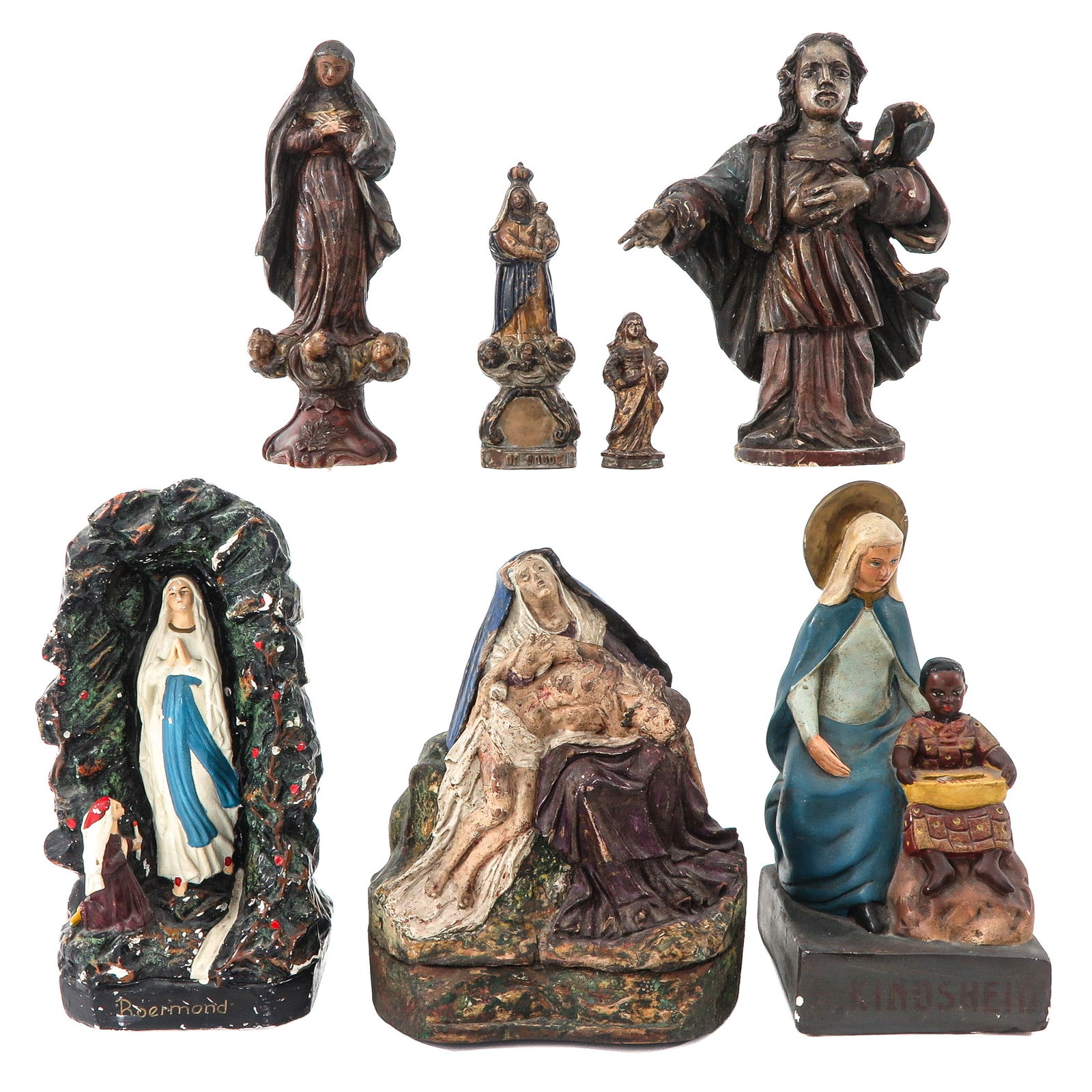 A Group of 7 Holy Statues: Consisting of seven holy statues, including a Pieta, height 34 cm.