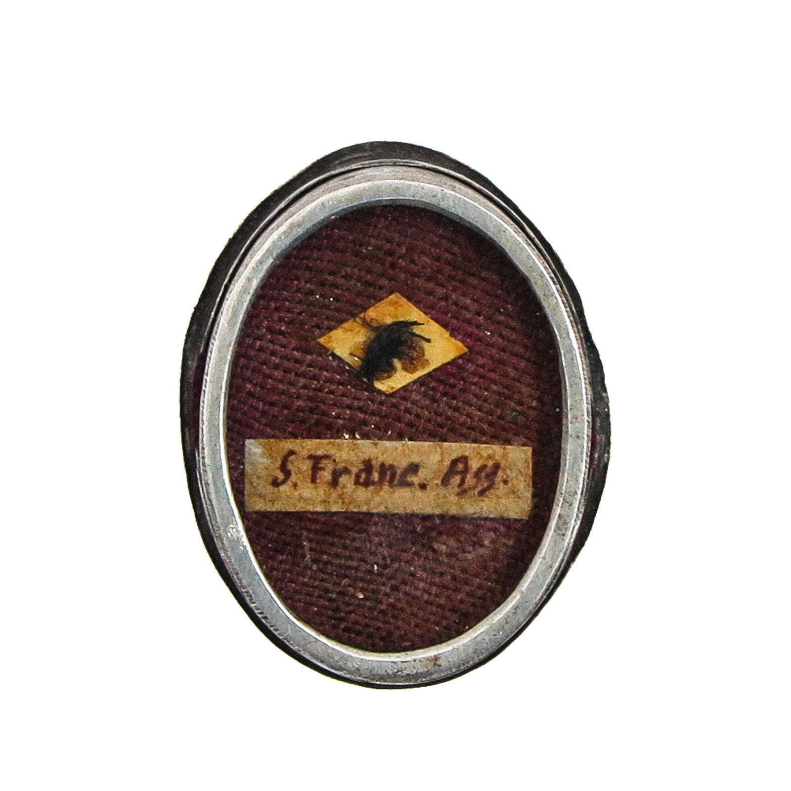 A Sealed Theca: Containing a relic of Saint Francis of Assisi, Confessor (patron of animals, ecology, and Italy), length 2 cm. You are purchasing the theca; the relics are a gift.
