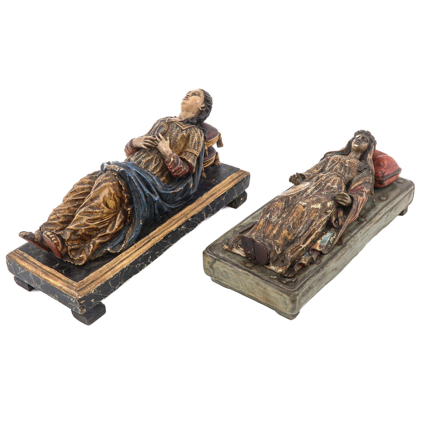 A Lot of 2 Religious Sculptures: Of two reclining religious sculptures, including a sculpture of Mary Magdalene, length 33 cm.