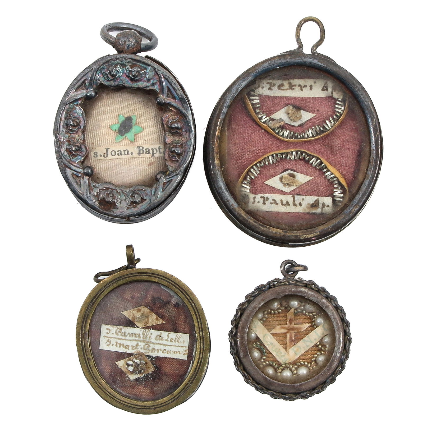 A Group of 4 Reliquary Pendants: Consisting of 4 reliquary pendants, containing relics of Saint John the Baptist (patron of converts, tailors, and shepherds) and a double relic with Saints Peter and Paul, the largest 3 cm long. You