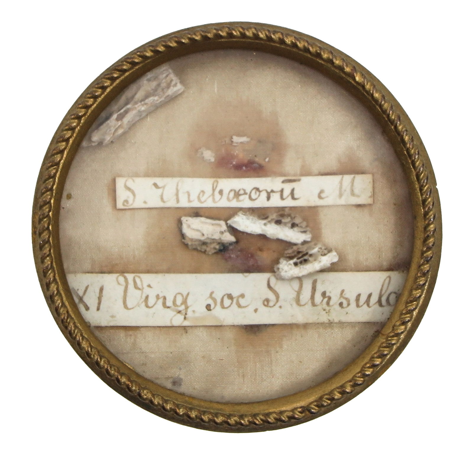 A Sealed Multi-Theca: Containing 2 relics, one of Saint Theodore, martyr (patron of soldiers and protection in battle) and Saint Ursula (patron of students and young women), 6 cm in diameter. You are purchasing the theca;