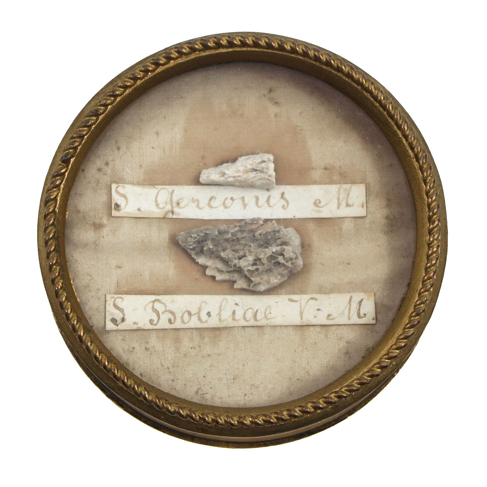 A Sealed Multi-Theca: Containing two relics: Saint Gervasius, martyr (patron against thunderstorms and sudden death) and Saint Bolitia, virgin and martyr (patron of chastity and steadfast faith). Diameter 6 cm. You are