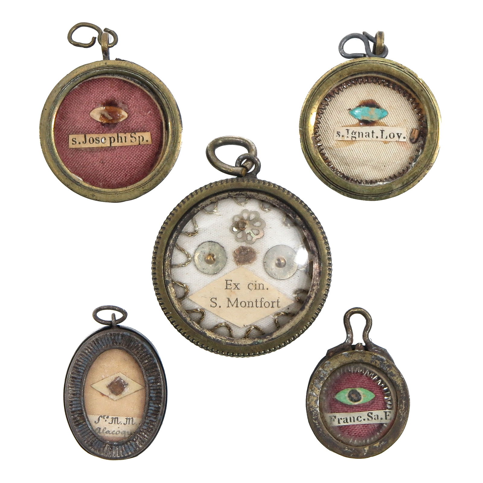 A Group of 5 Reliquary Pendants: Consisting of 5 reliquary pendants, containing relics of Saint Joseph (patron of workers, families, and saints) and Saint Ignatius of Loyola (patron of retreats and spiritual exercises), largest 3