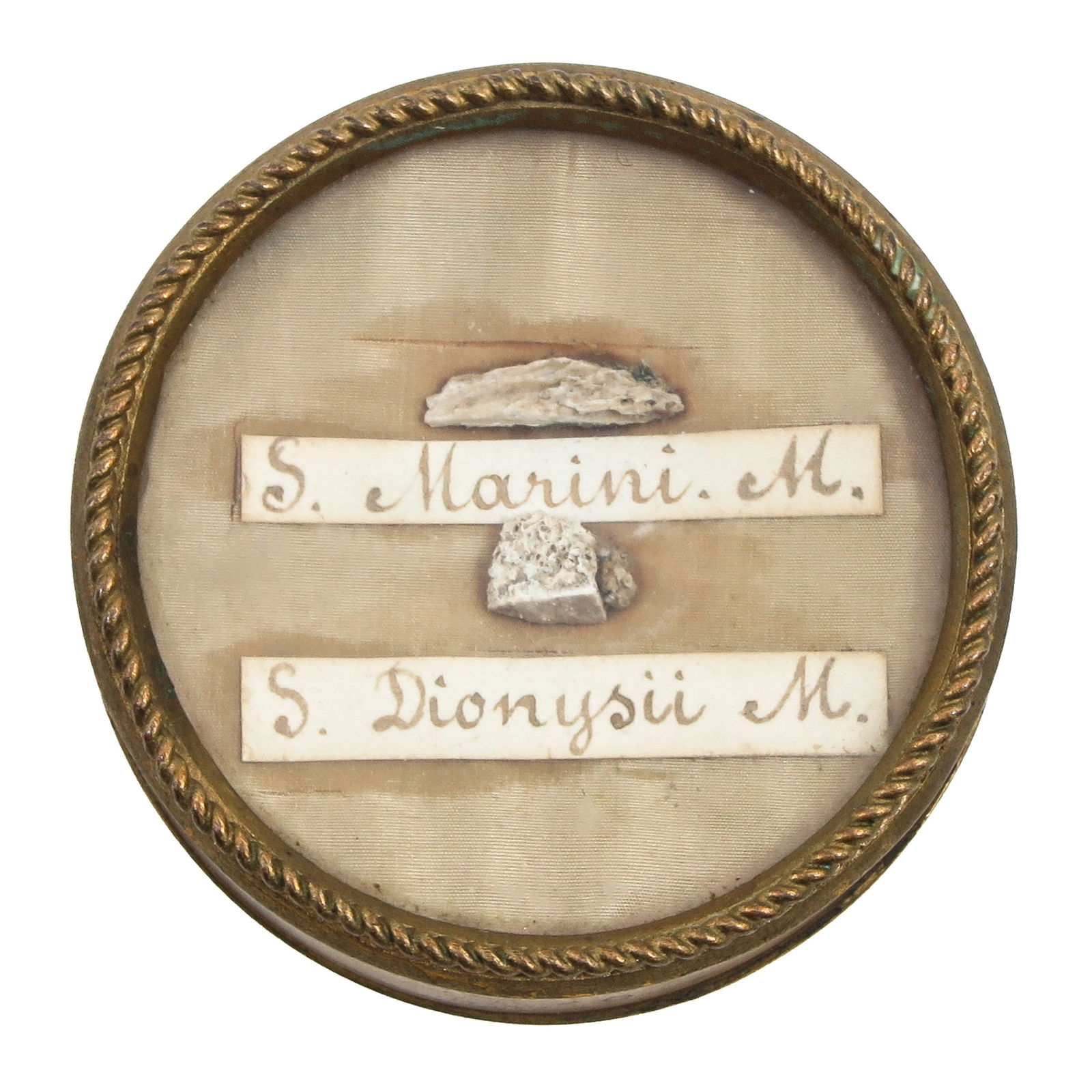 A Sealed Multi-Theca: Containing two relics, including Saint Marinus, martyr (patron of stonemasons and masons), diameter 6 cm. You are purchasing the theca; the relics are a gift.