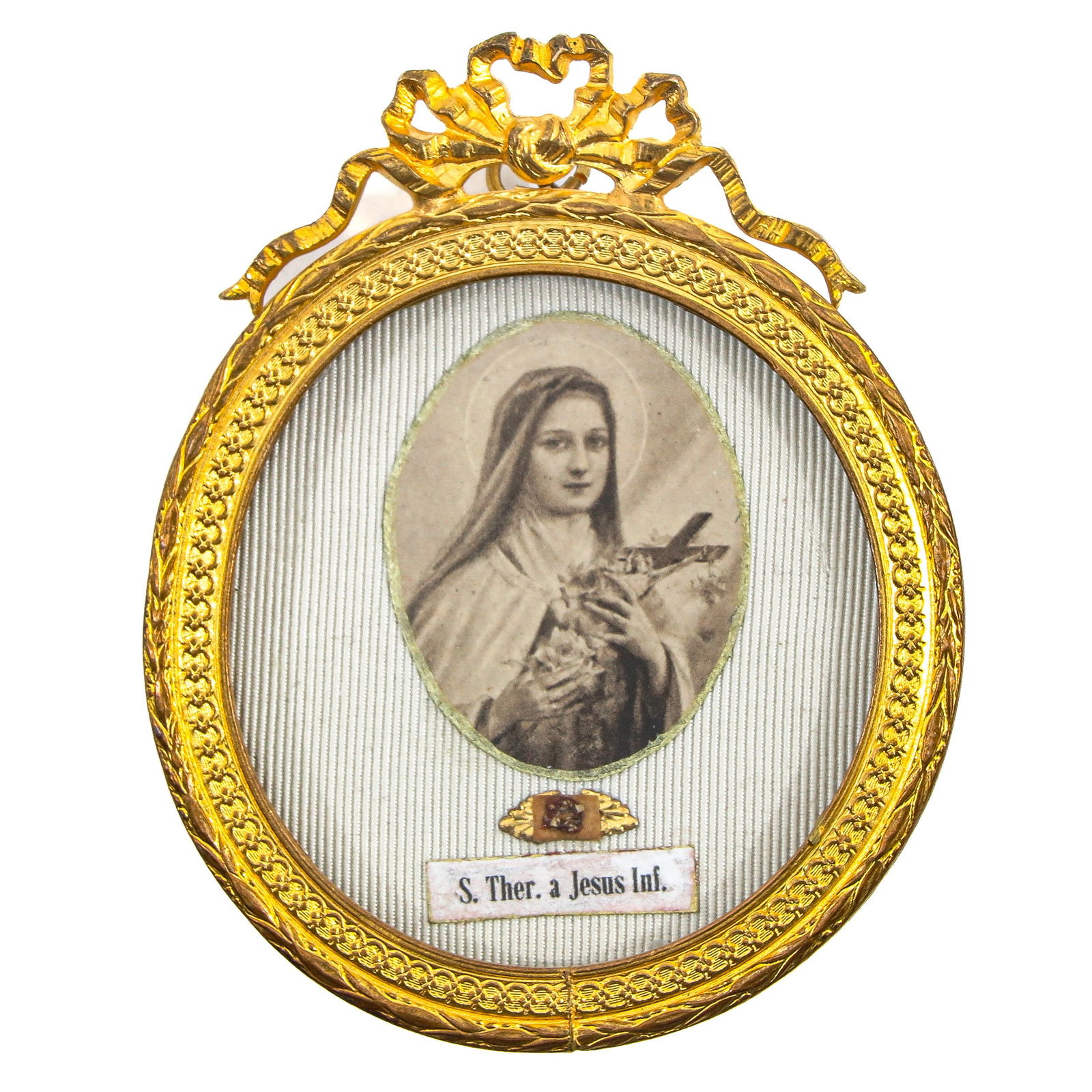 A Standing Reliquary Frame: Containing a relic of Saint Therese of the Child Jesus, Carmelite (patron of missionaries, France, and florists), height 8 cm. You are purchasing the theca. The relics are a gift.