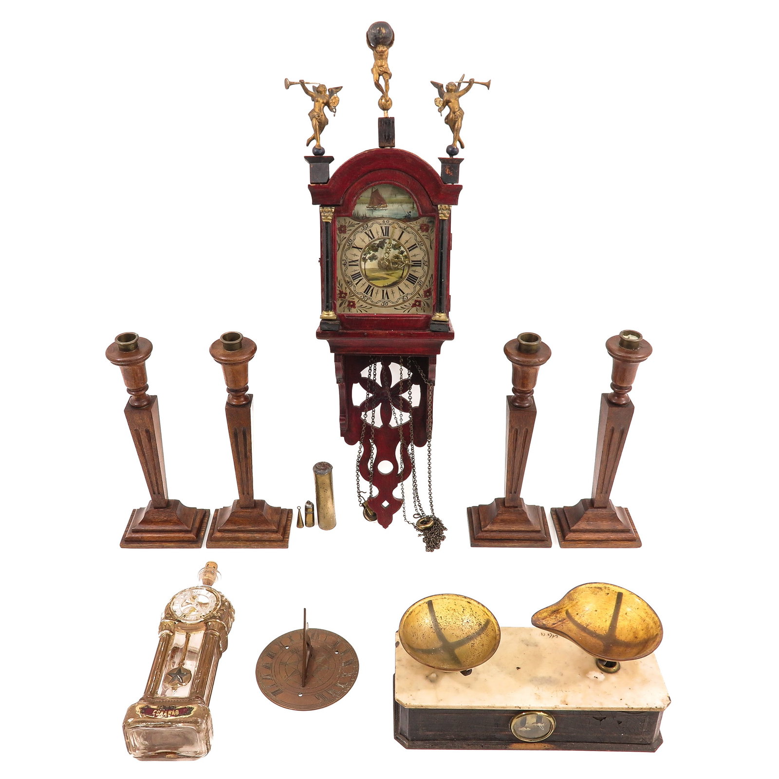 A Diverse Collection of Items: of various objects, including a balance/scale with marble top and two small bowls, a glass liqueur bottle in the shape of a grandfather clock, 4 wooden Art Deco candlesticks and a small ship's tail