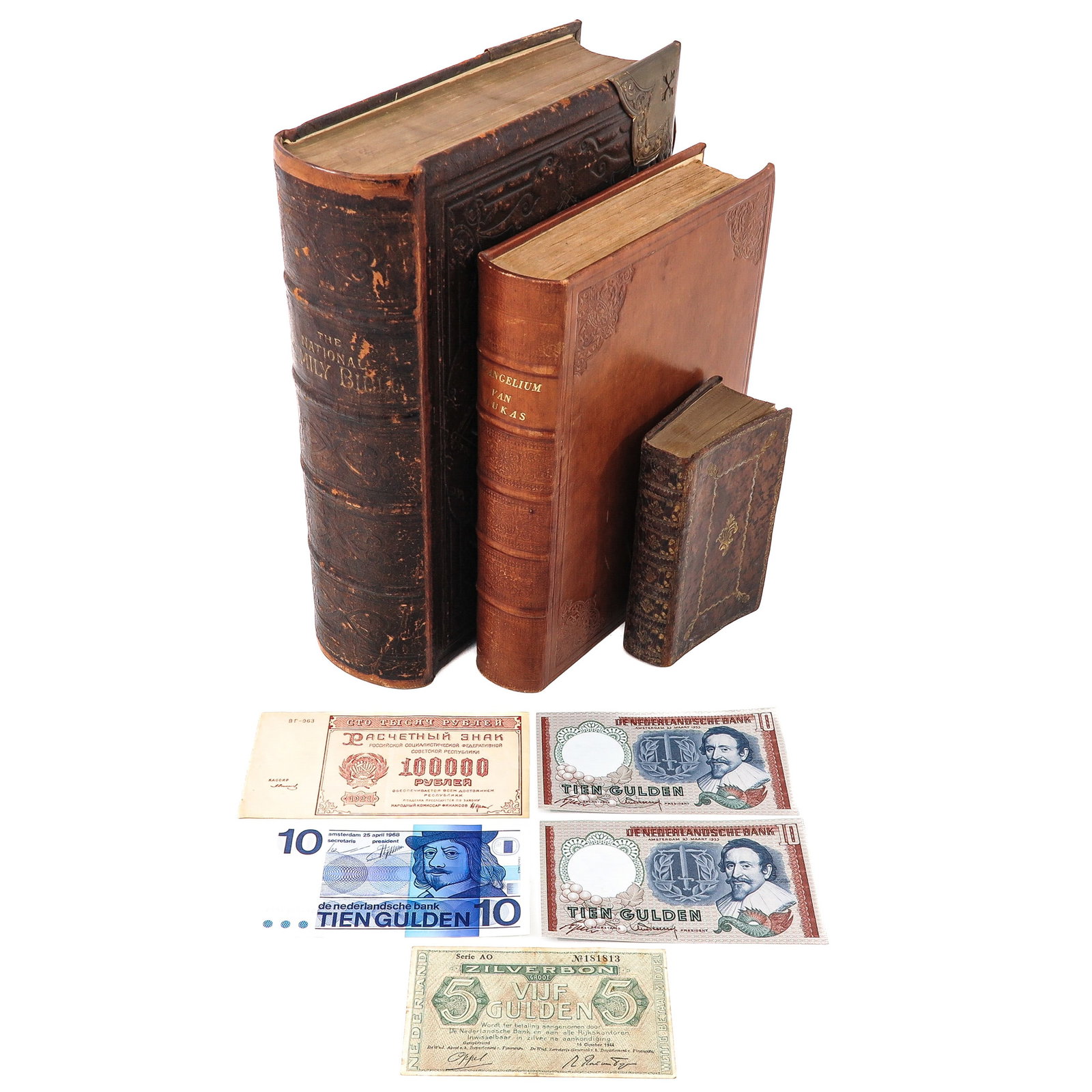 A Group of Books and Banknotes: consisting of books and banknotes. including The National Family Bible