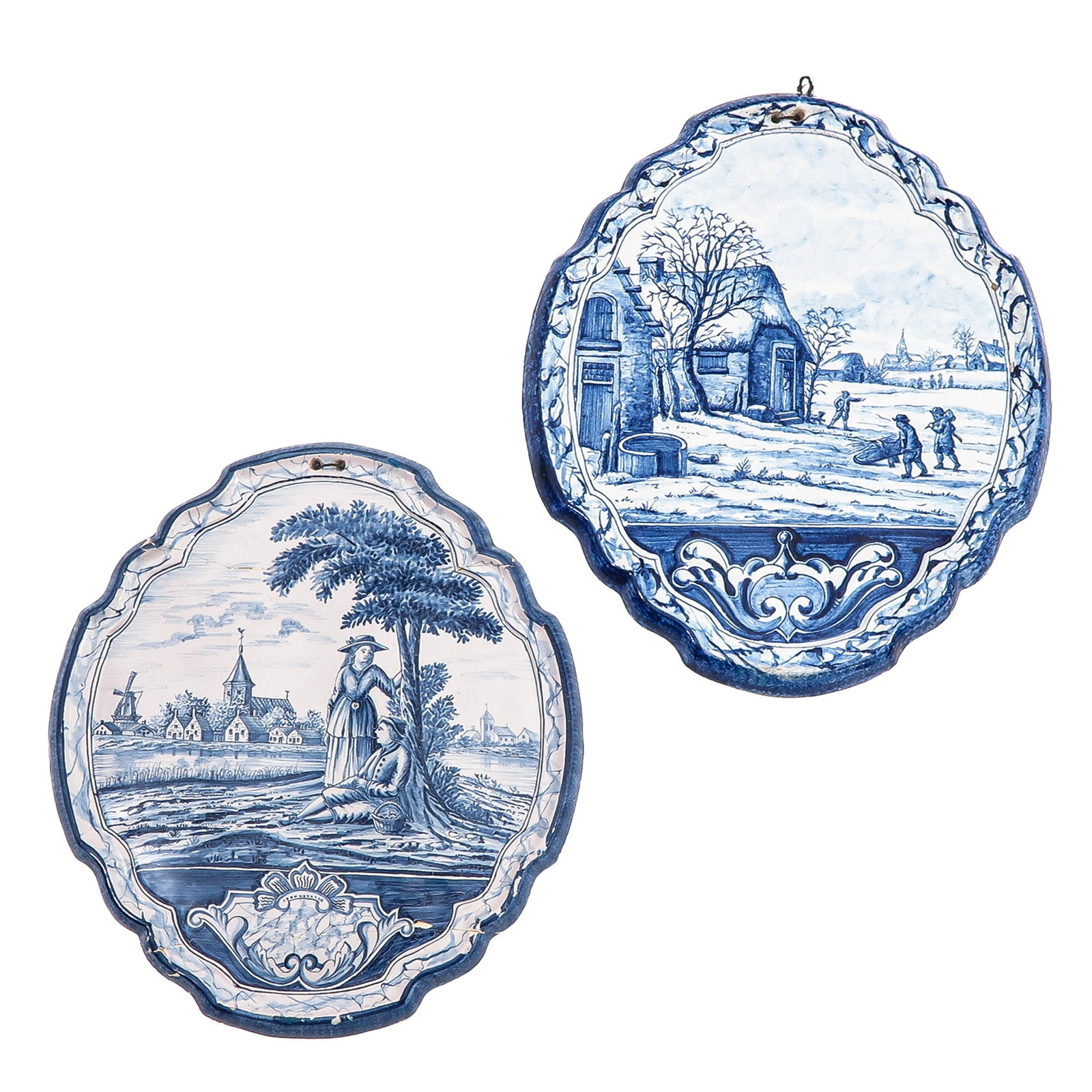 A Lot of 2 Delft Plaques: of 2 Delft plaques with landscape depictions, 33 x 39 cm, restored