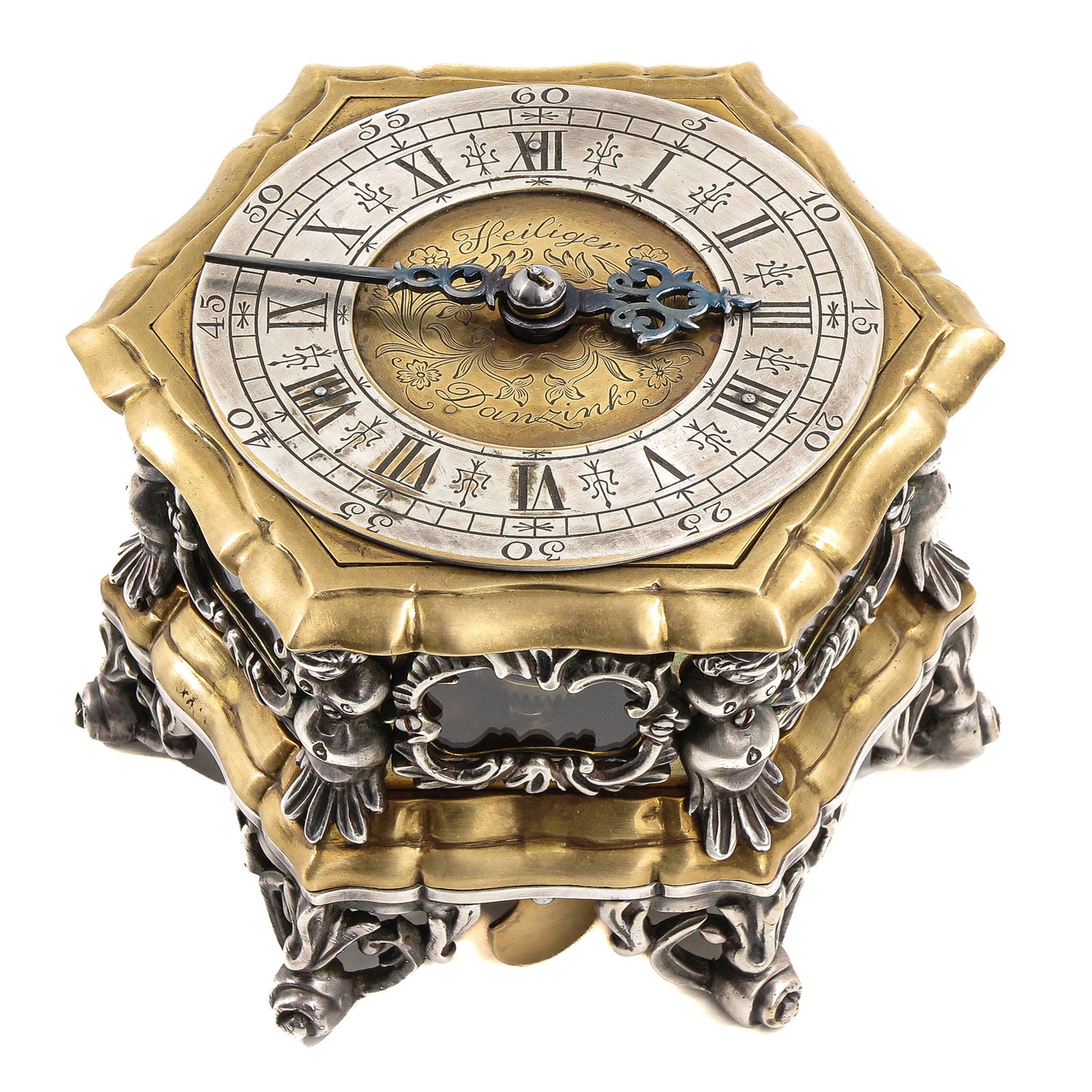 An 18th Century Tischuhr Clock signed Heiliger Danzig: signed Heiliger Danzig, 18th century, diameter 13, height 9 cm, decorated on each corner with a figure of a lady