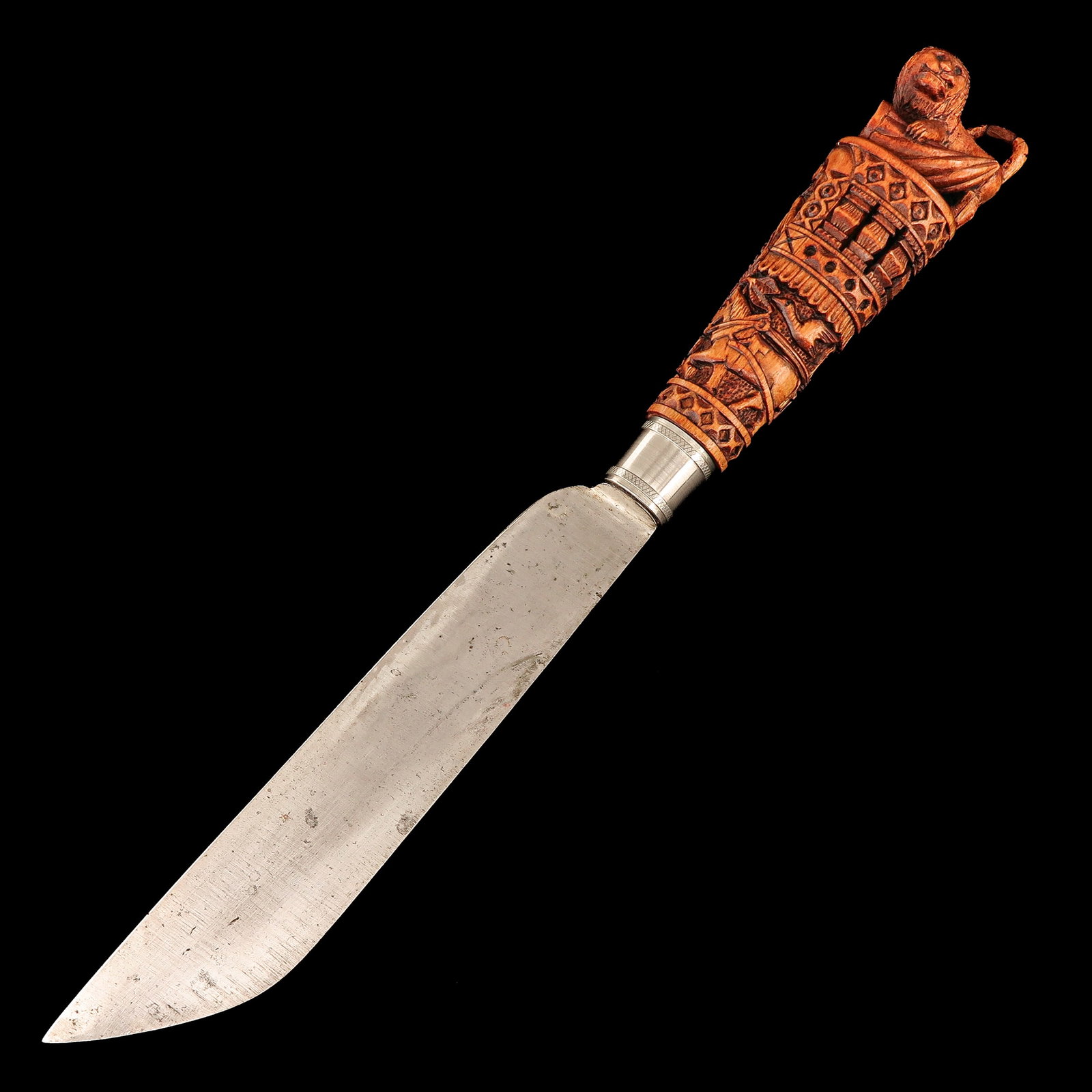 A Paeremes: with a carved wooden handle, with a lion on top and with a depiction of a horse and carriage, length 33 cm