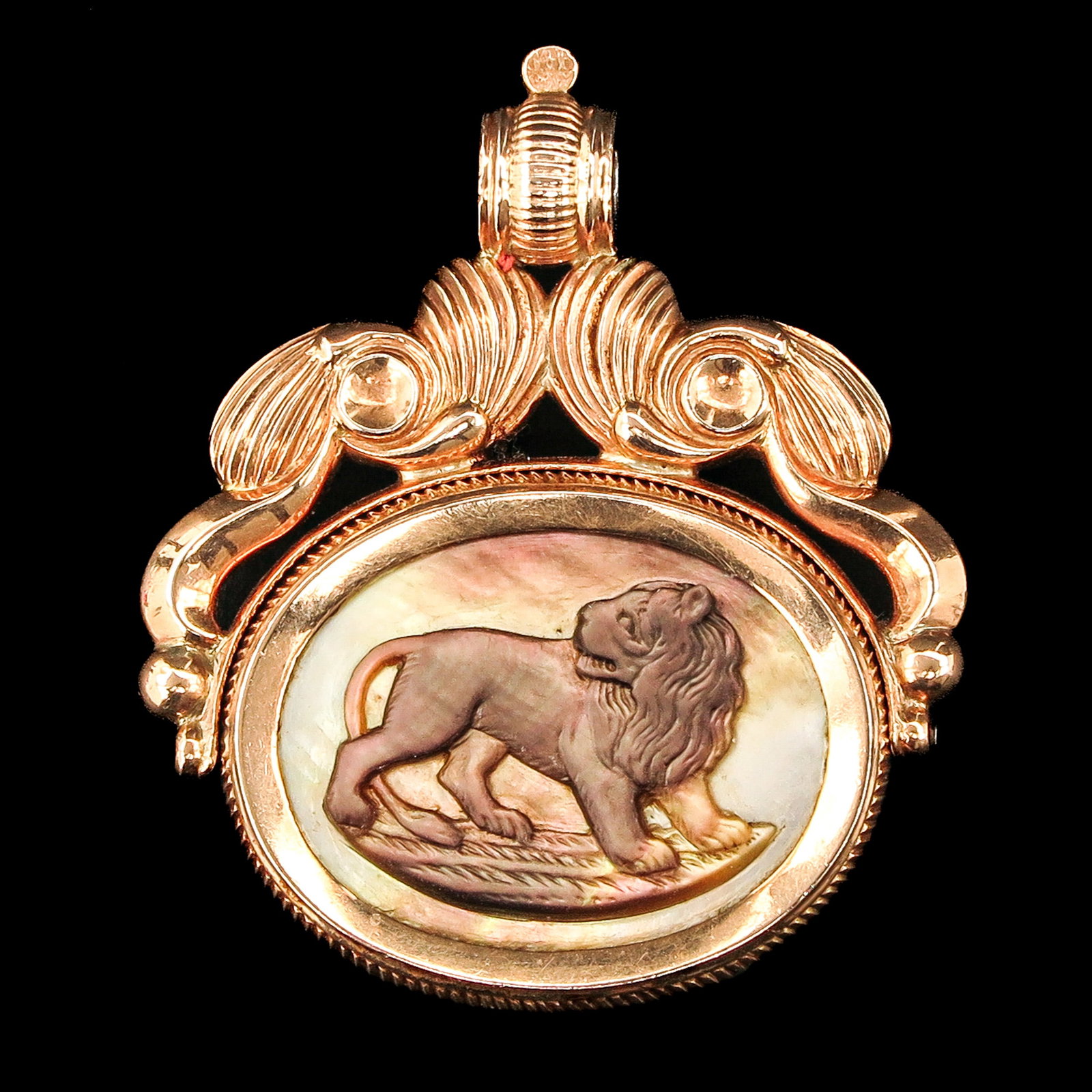 An 18KG Watch Signet: 18 Krt. gold, with mother-of-pearl relief of a lion, Republic symbols, Dutch Empire, 40 x 45 mm