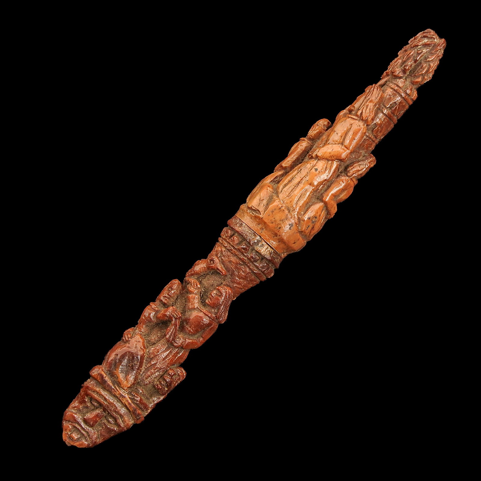 A Carved Wood Needle Case: palm wood, very finely carved, length 11 cm