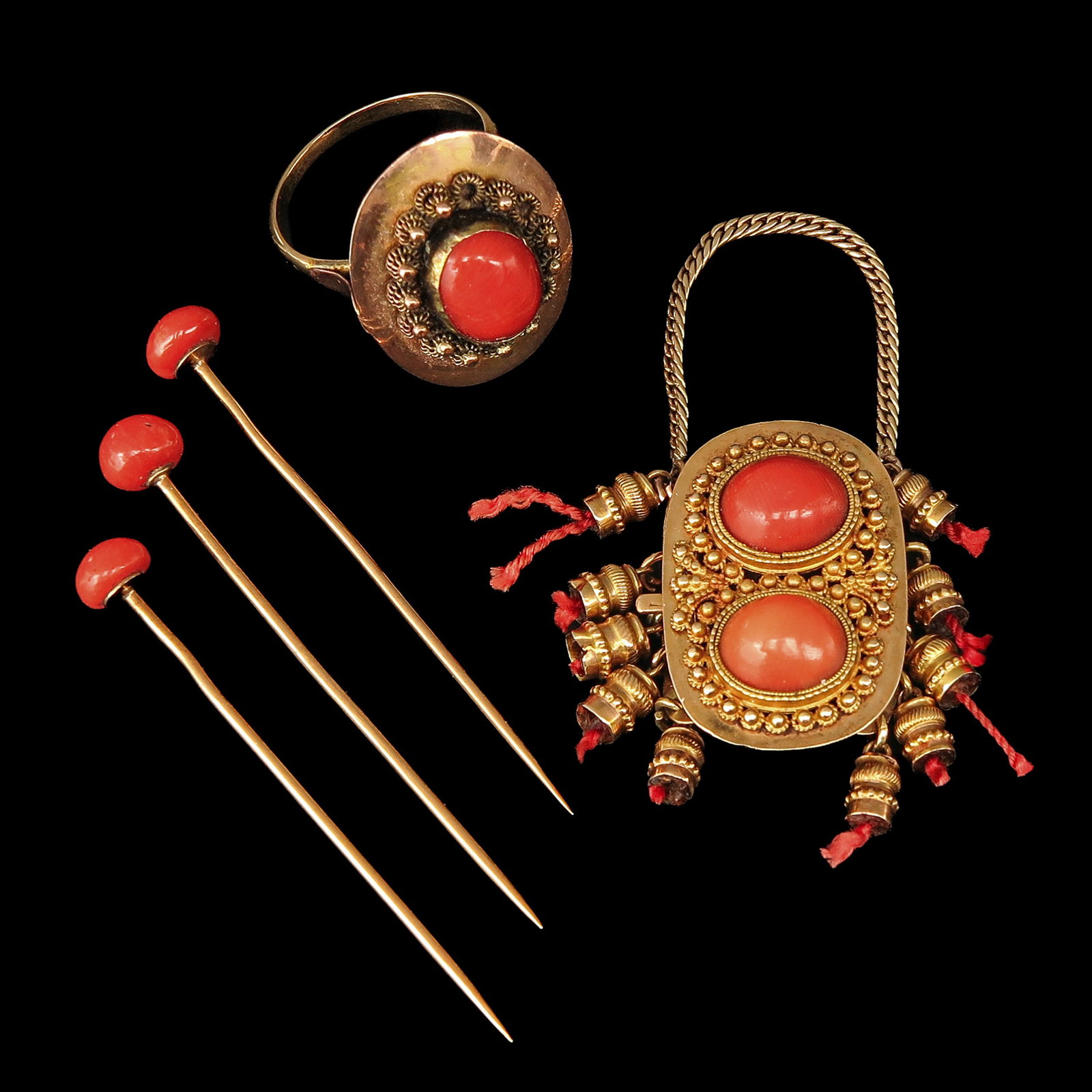 A Group of Red Coral Jewelry: consisting of a gold clasp, 3 gold pins and a ring, all set with red coral, ring size 16.5