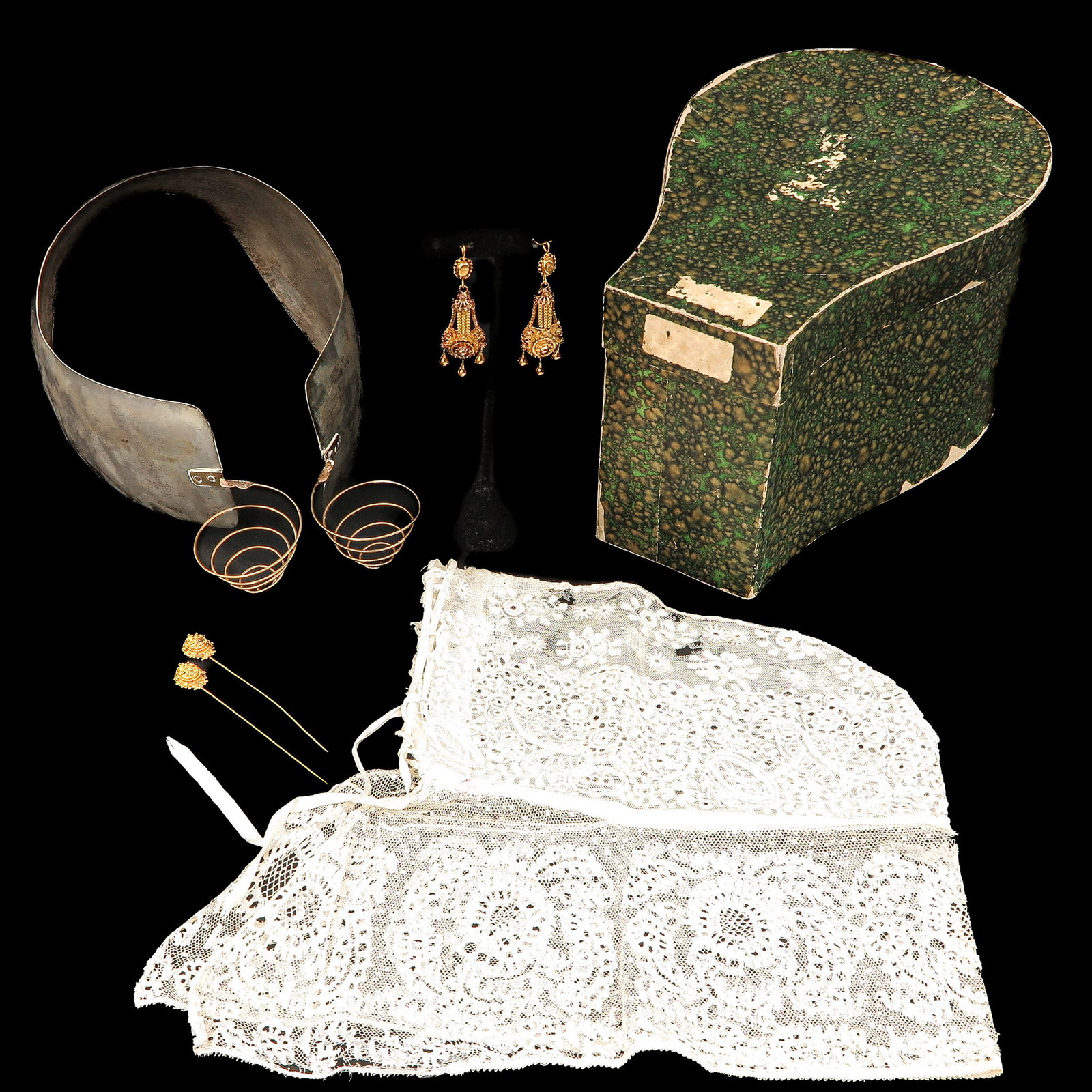 A Group of Traditional Dutch Jewelry: consisting of silver ear ornaments with gold curls, 2 pins, 2 curl pendants and a cap, Vlaardingen, including 14 and 18 Krt. gold