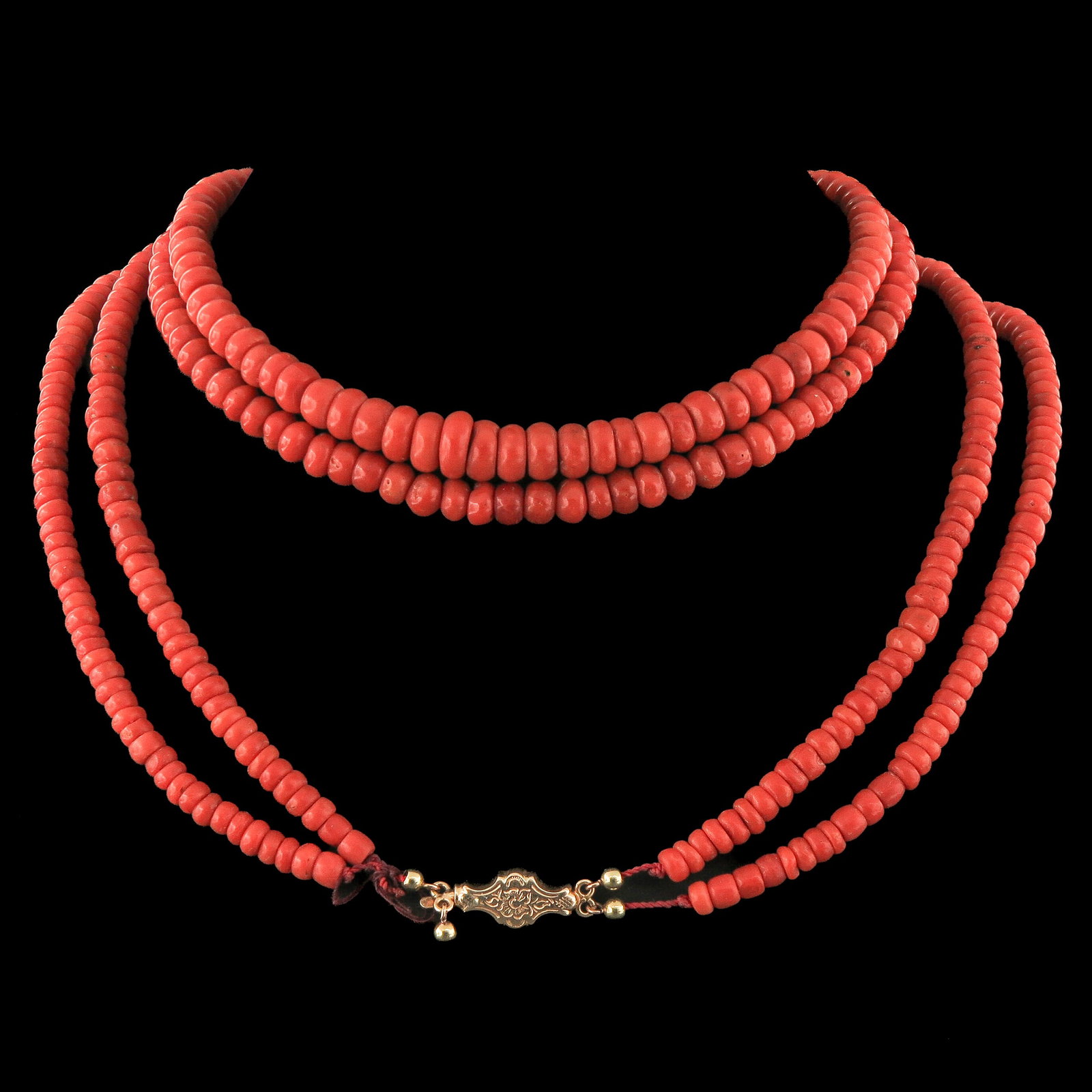 A Red Coral Necklace: with 2 rows, red coral, bead diameter 5 - 7 mm, weight 96 grams, length 76 cm