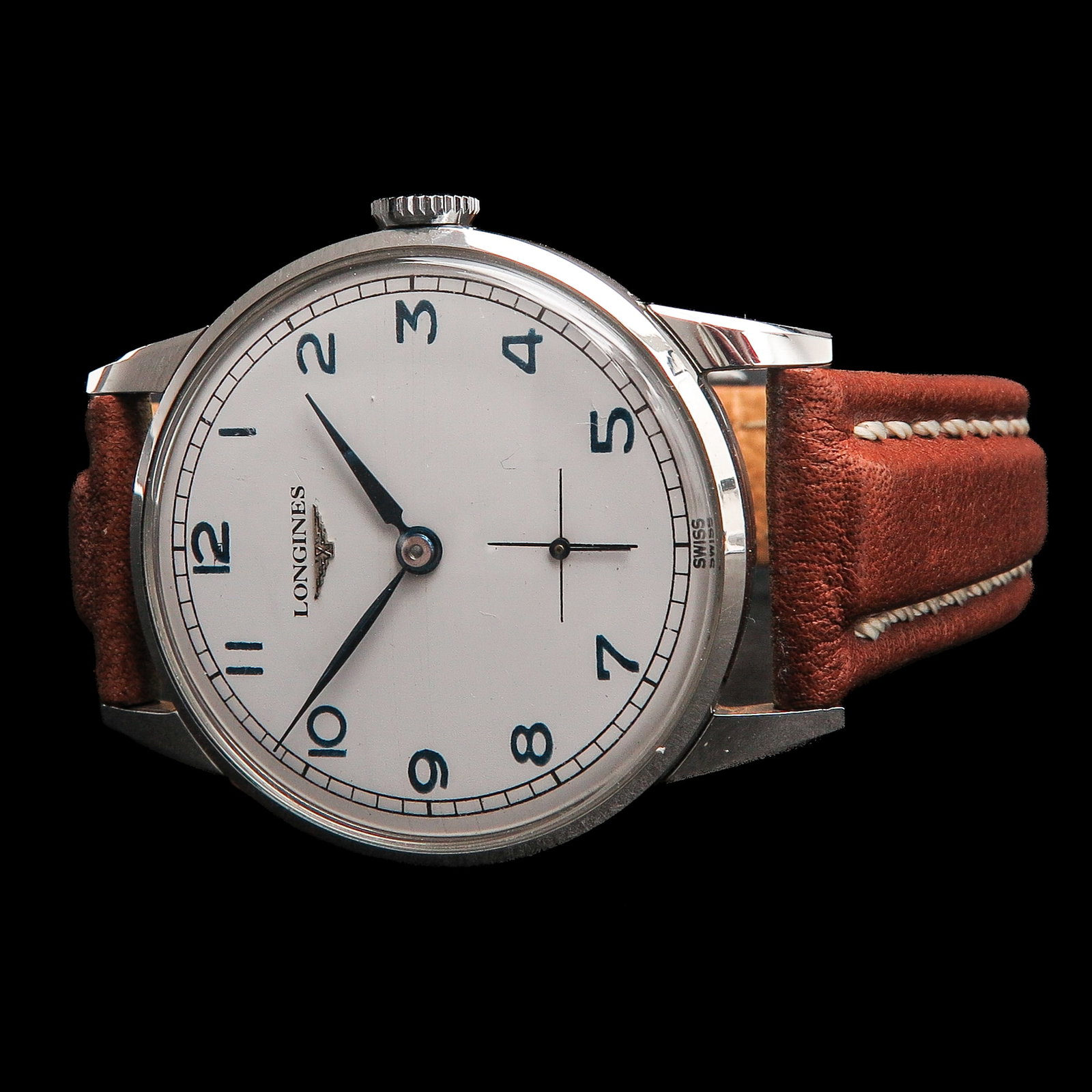 A Mens Longines Watch: Longines Calatrava, hand-wound, steel, with brown leather strap, case diameter 34 mm