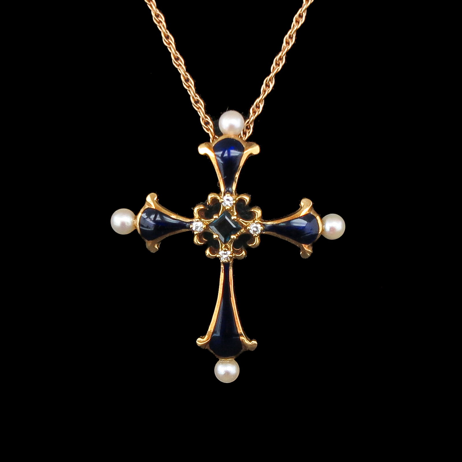 A Carl Fabergé Necklace: with pendant, 18 Krt. gold, “Midnight Cross”, from the house of Igor Carl Fabergé, set with sapphire and pearls, with certificate of authenticity, pendant 30 x 35 mm, necklace length 41 cm
