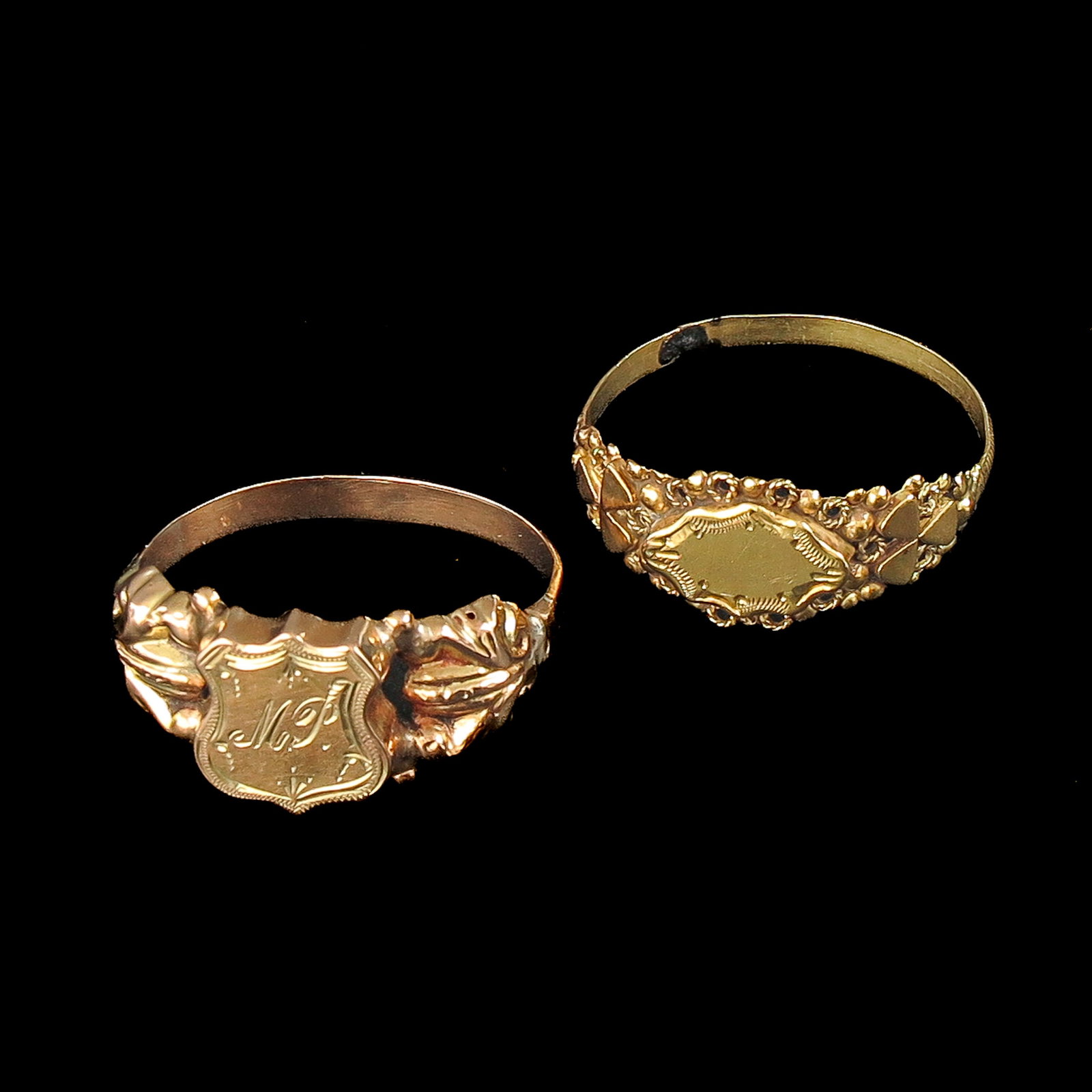 A Lot of Gold Rings: consisting of 2 gold rings, including a signet ring, largest ring size 20.5