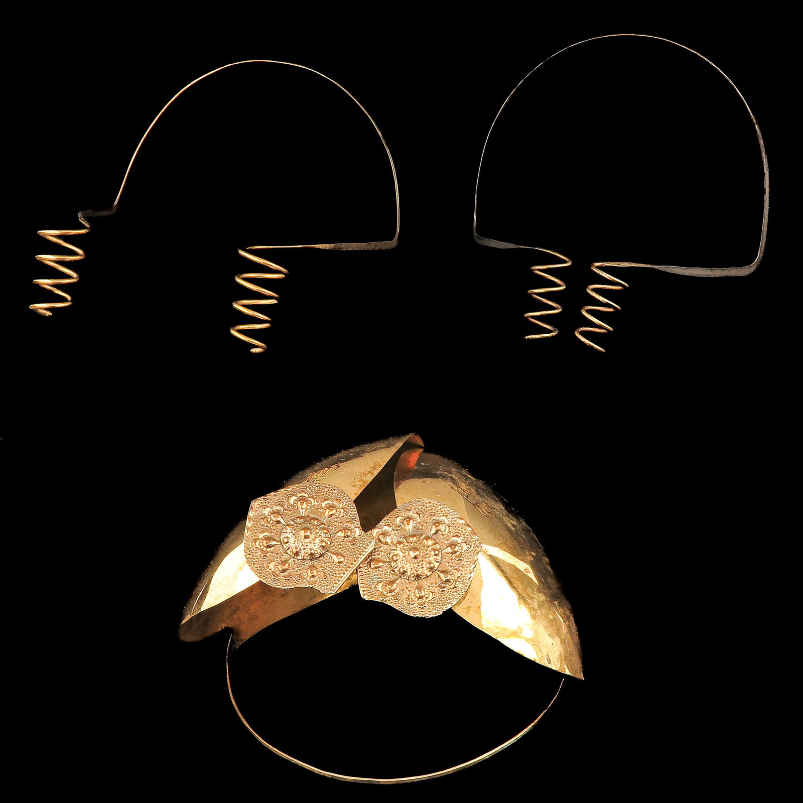 A Group of Traditional Dutch Jewelry: consisting of a copper ear ornament, Friesland, and 2 ear ornaments with curls, Walcheren