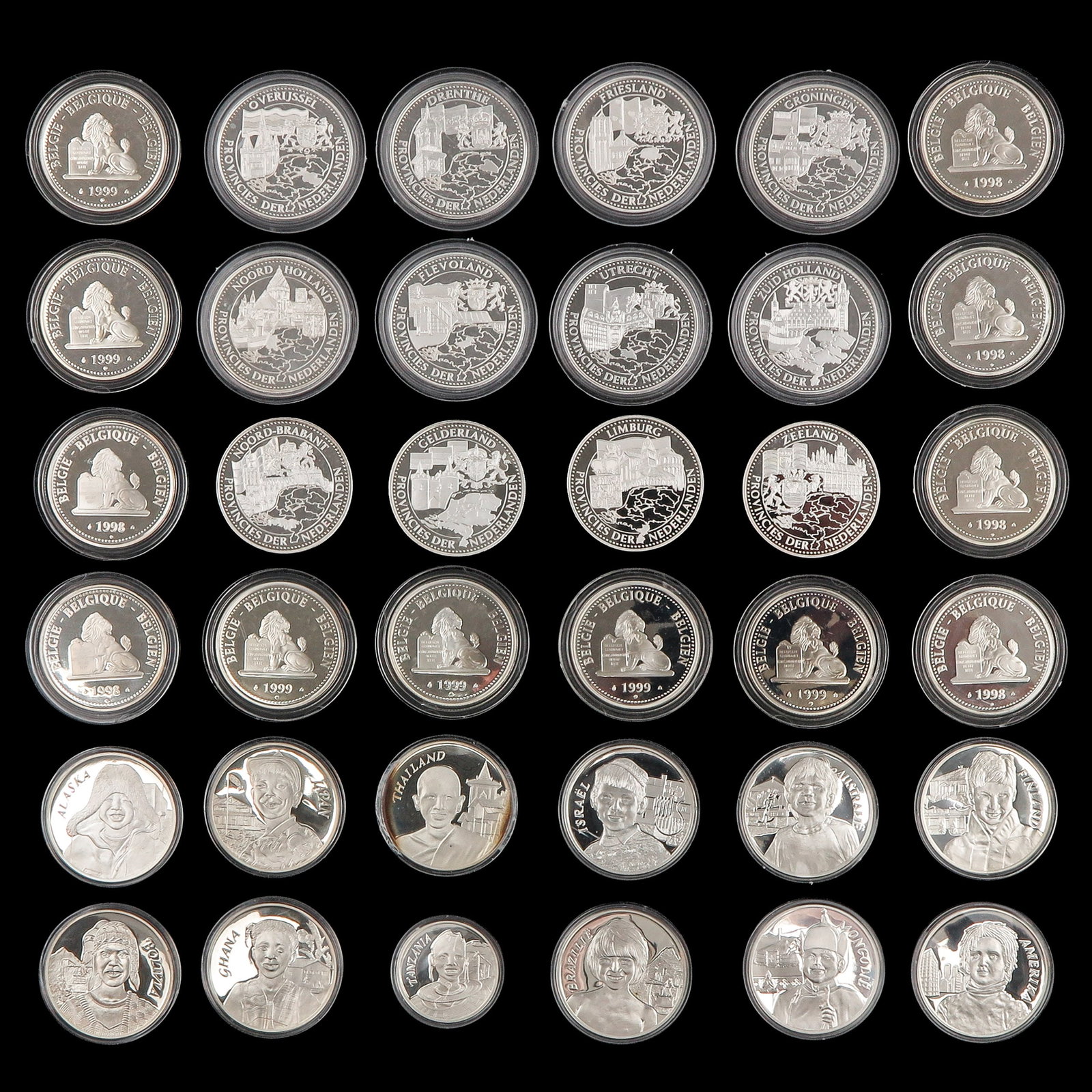 A Group of 3 Cassettes with Coins: consisting of 3 cassettes with coins, including silver