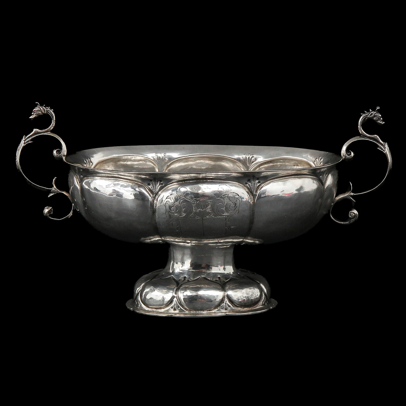 A 17th Century Silver Brandy Bowl: 17th century, silver, Groningen, Arent Hammink, 1660 - 1661, eight-lobed, with S-shaped ears crowned by dragon heads, 22 x 13 cm