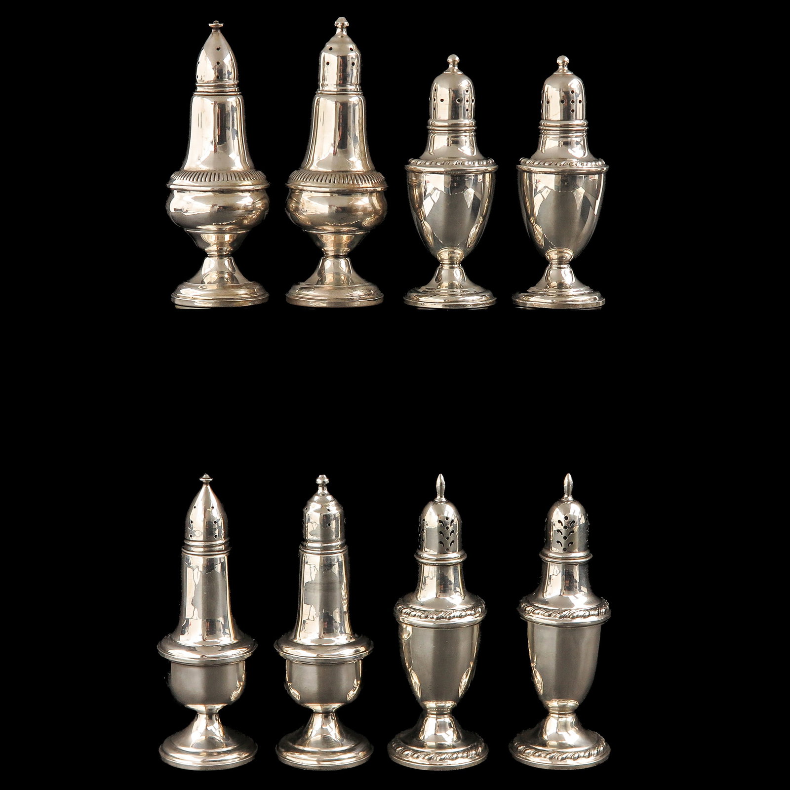 A Group of Silver Castors: consisting of 4 pairs of silver shakers, tallest 14 cm