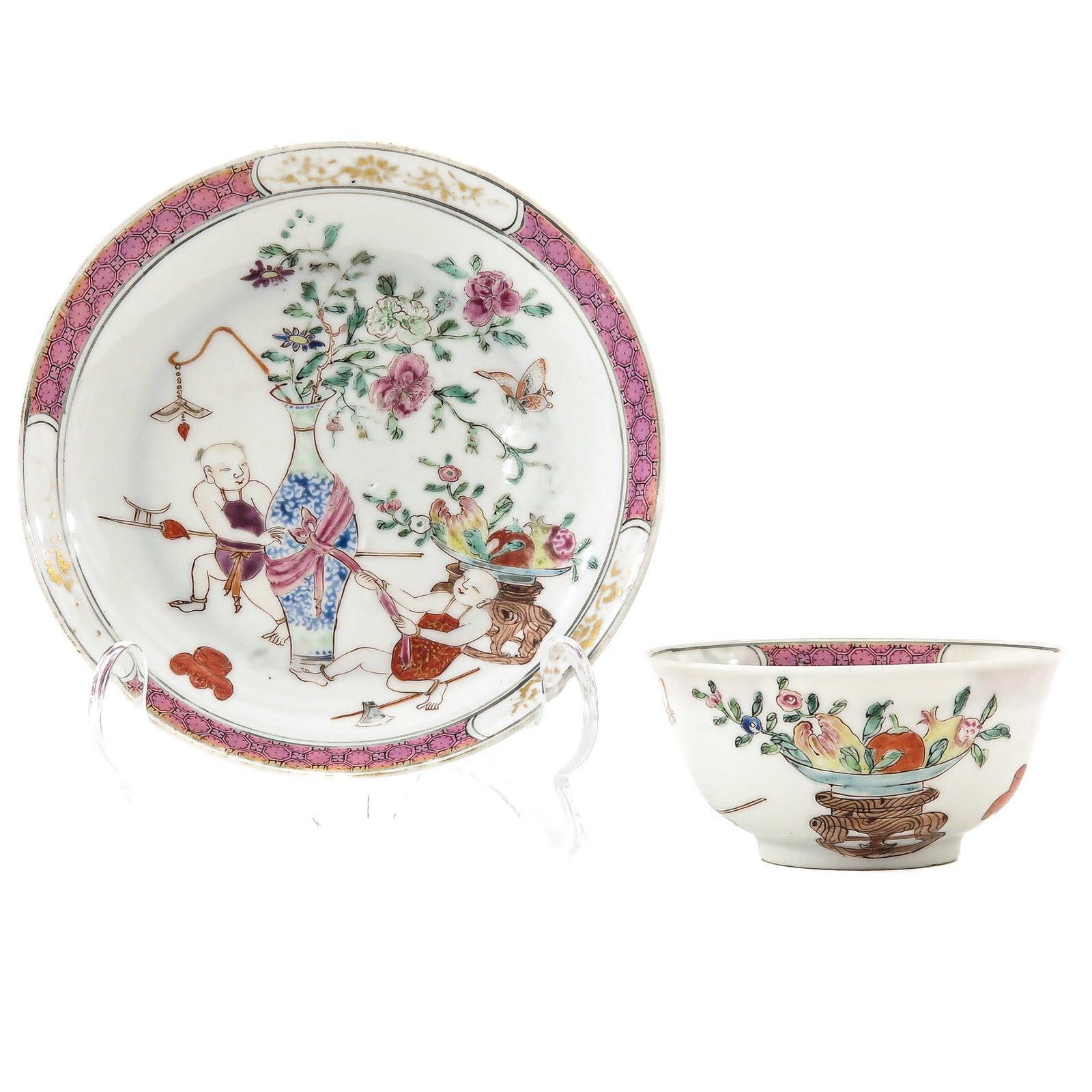 A Yongzheng Period Cup and Saucer: Depicting Chinese figures in a garden scene in Famille Rose enamels, Yongzheng Period, saucer is 13 cm in diameter.