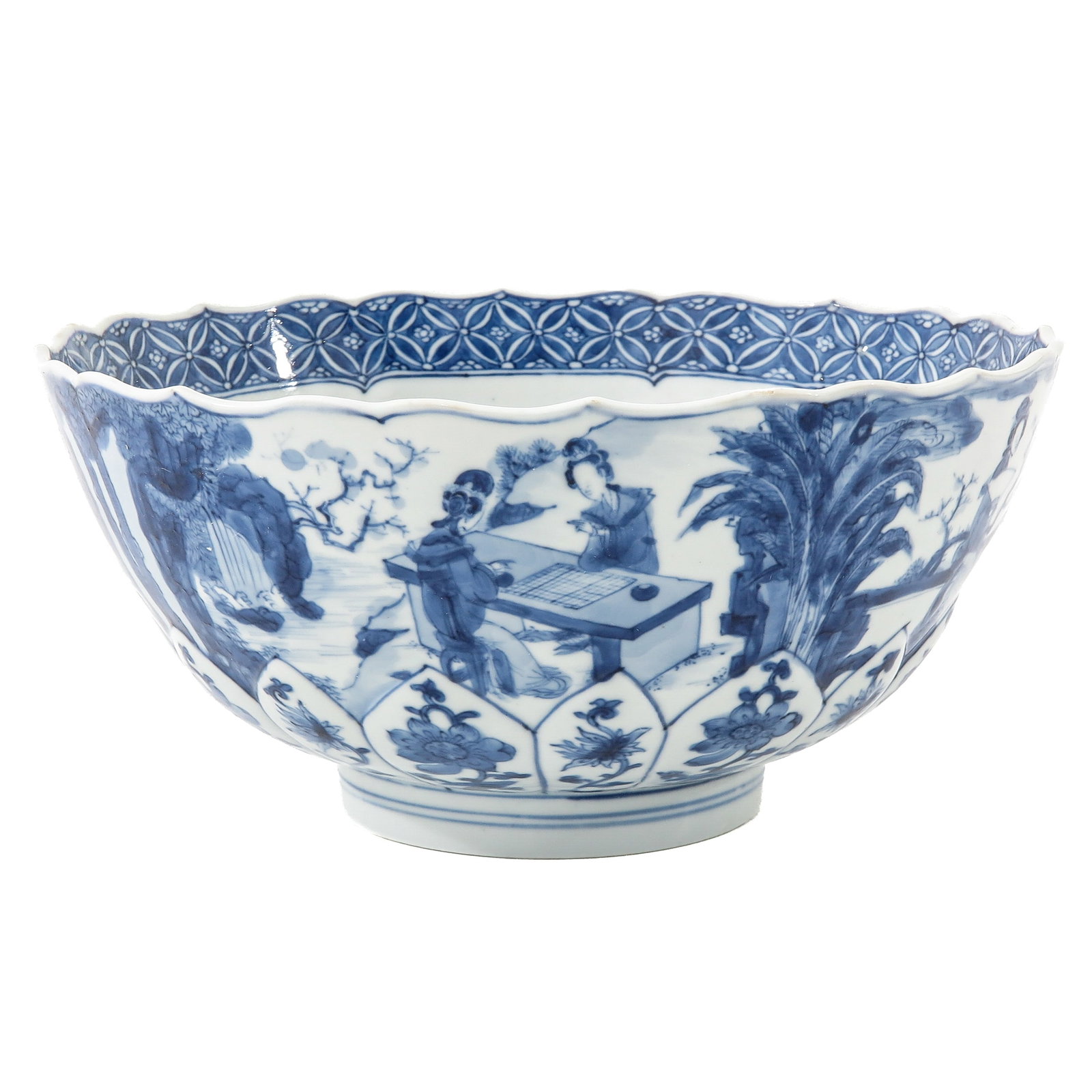 A Blue and White Bowl: Decorated with diverse scenes of ladies in a garden, Kangxi Mark and Period, 21 cm in diameter.