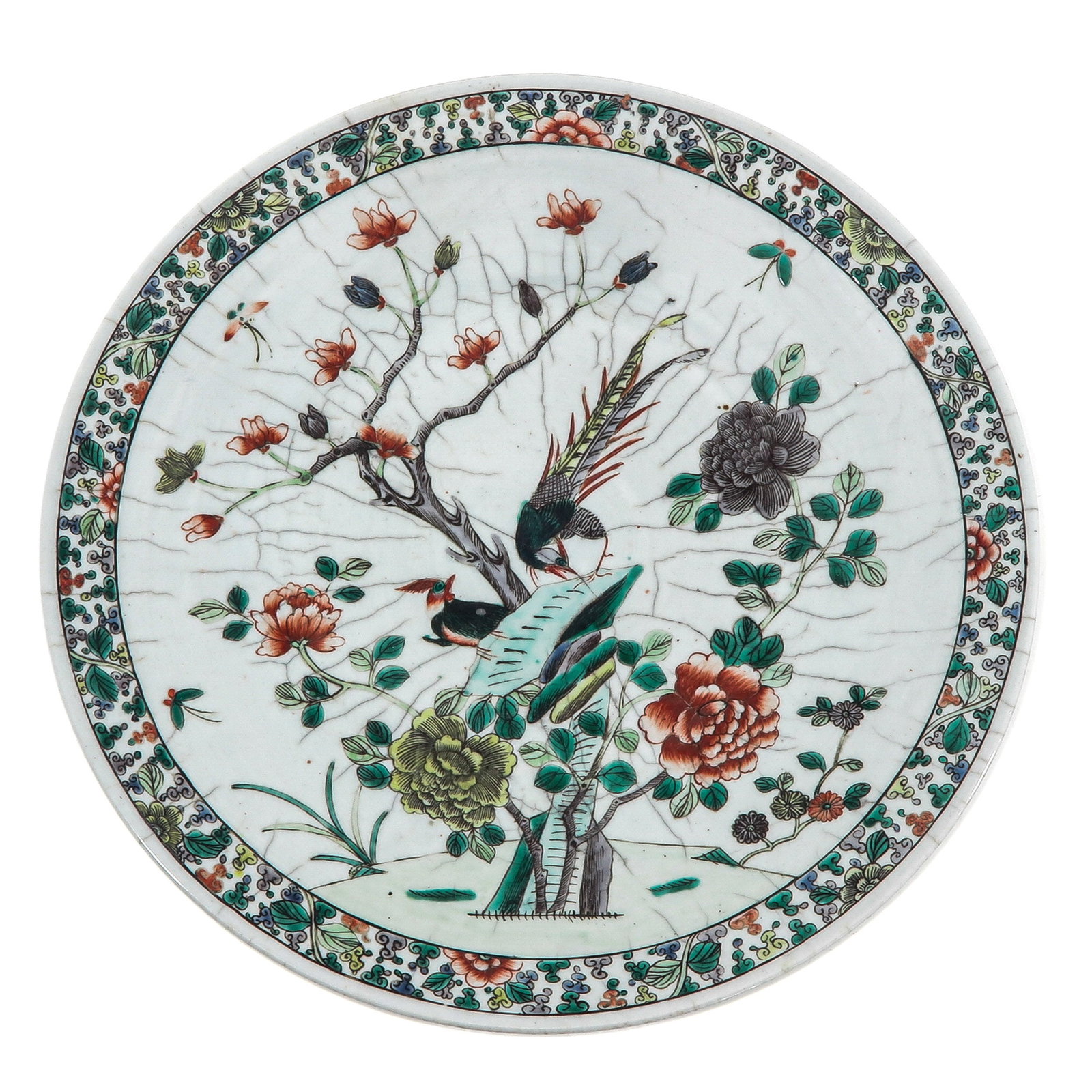 A Famille Verte Charger: Decorated with birds amongst flowering branches and peonies with crackle ground, 40 cm in diameter.