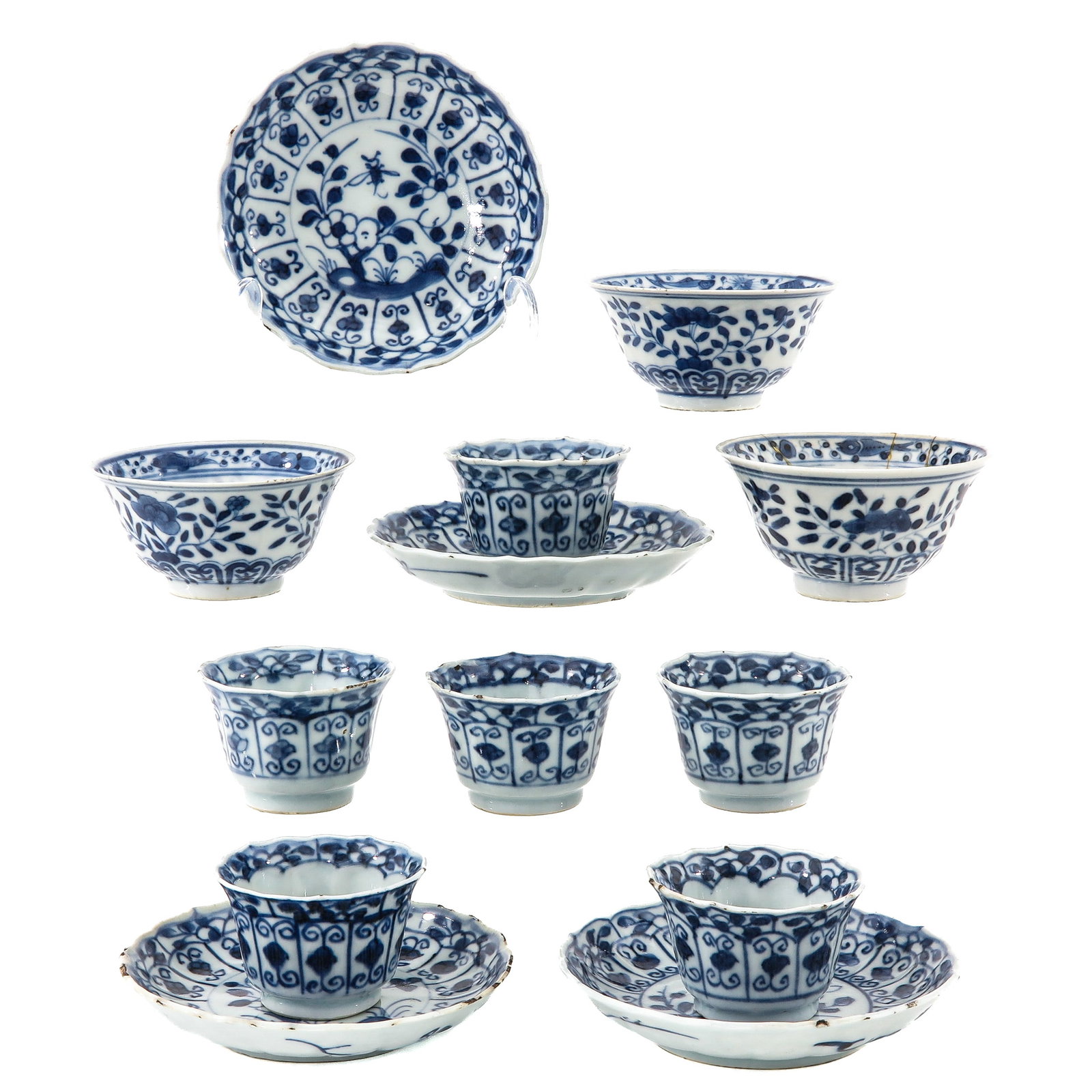 A Group of Cups and Saucers: 13 pieces, in a variety of blue and white decors, including 18th Century, largest saucer is 12 cm in diameter, chip and hairline.