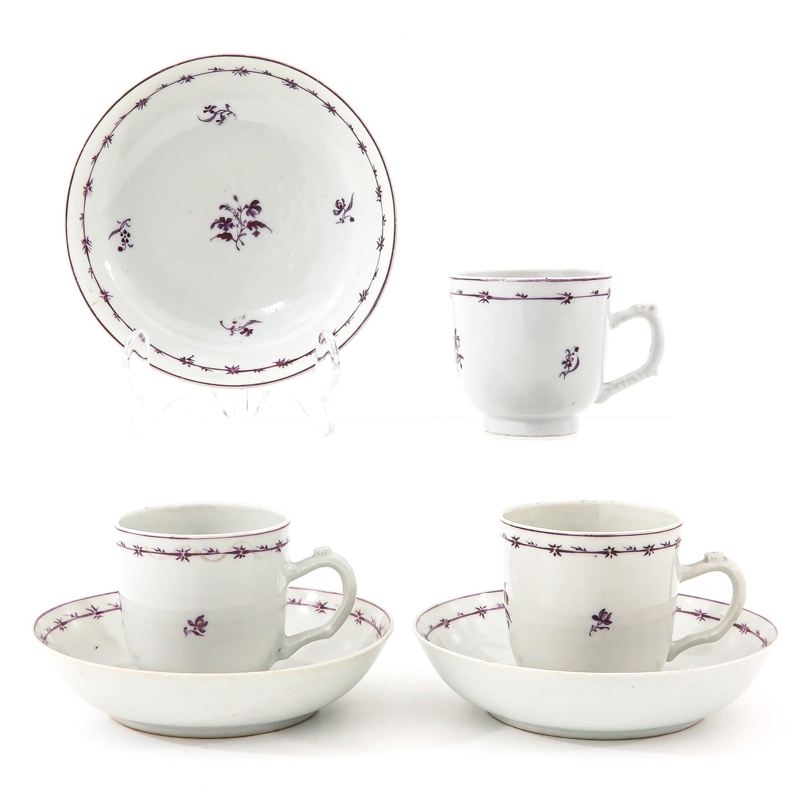 A Group of 3 Cups and Saucers: Including 3 floral decor handled cups with saucers, 18th Century, saucers are 14 cm in diameter, chip and hairline.