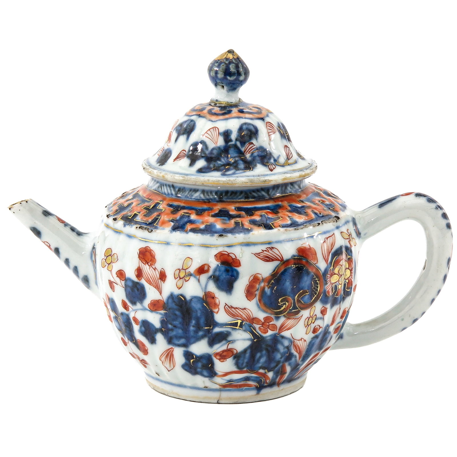 An Imari Teapot: Depicting a scene in a garden with flowers, 18th Century, 15 cm tall, restoration on cover.